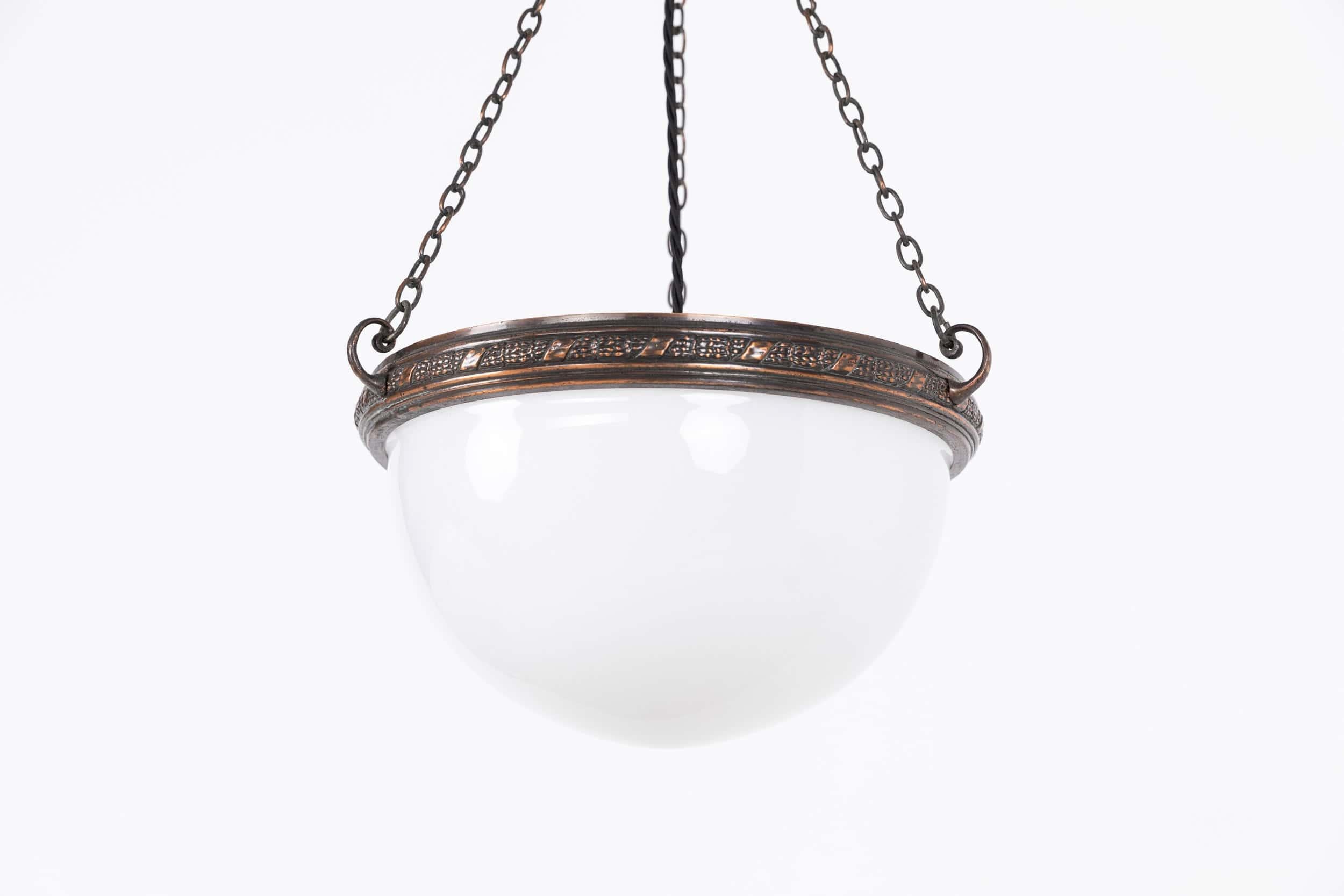 

An incredibly elegant luminous opaline bowl plafonnier lamp made in England. c.1930

Bright white opal bowl supported in original decorative copper ring, chain and ceiling mount.

Rewired with black twisted flex.
