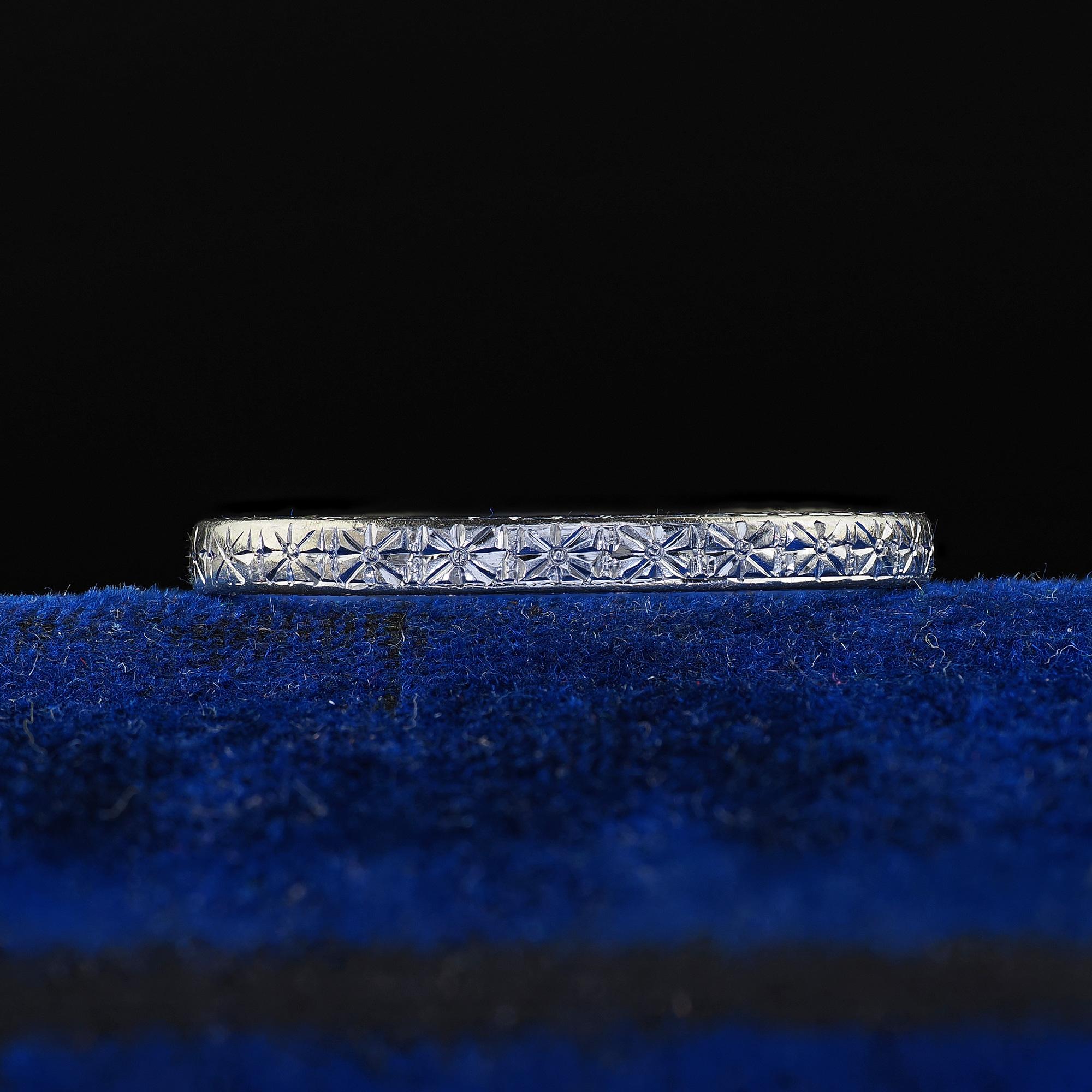 Beautiful Antique Art Deco Orange Blossom 18K White Gold Engraved Wedding Band Circa 1928. This gorgeous Art Deco wedding band is crafted in 18k white gold. The ring features beautiful engravings around the entire ring and the inside of the band is