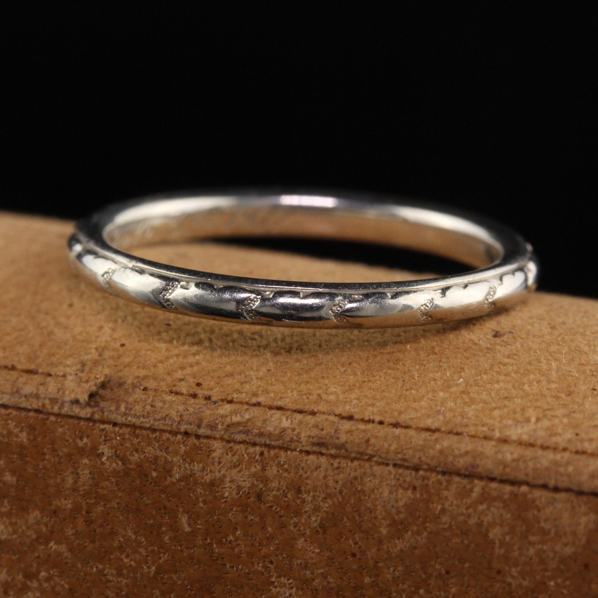 Beautiful Antique Art Deco Orange Blossom 18K White Gold Engraved Wedding Band. This classic wedding band is made by Orange Blossom and crafted in 18K white gold. It has engravings going around the entire ring and inside of the ring is engraved 