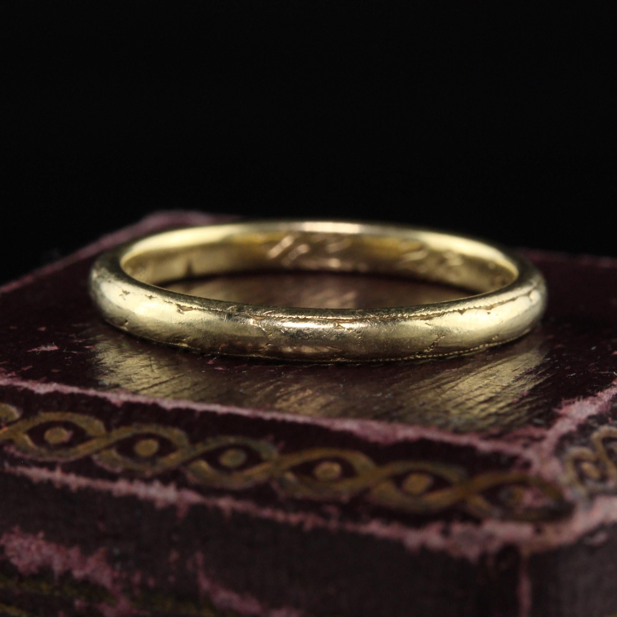 Beautiful Antique Art Deco Orange Blossom 18K Yellow Gold Engraved Wedding Band. This classic band is crafted in 18k yellow gold. The band has faded engravings on the top with the inside of the ring being deeply engraved 