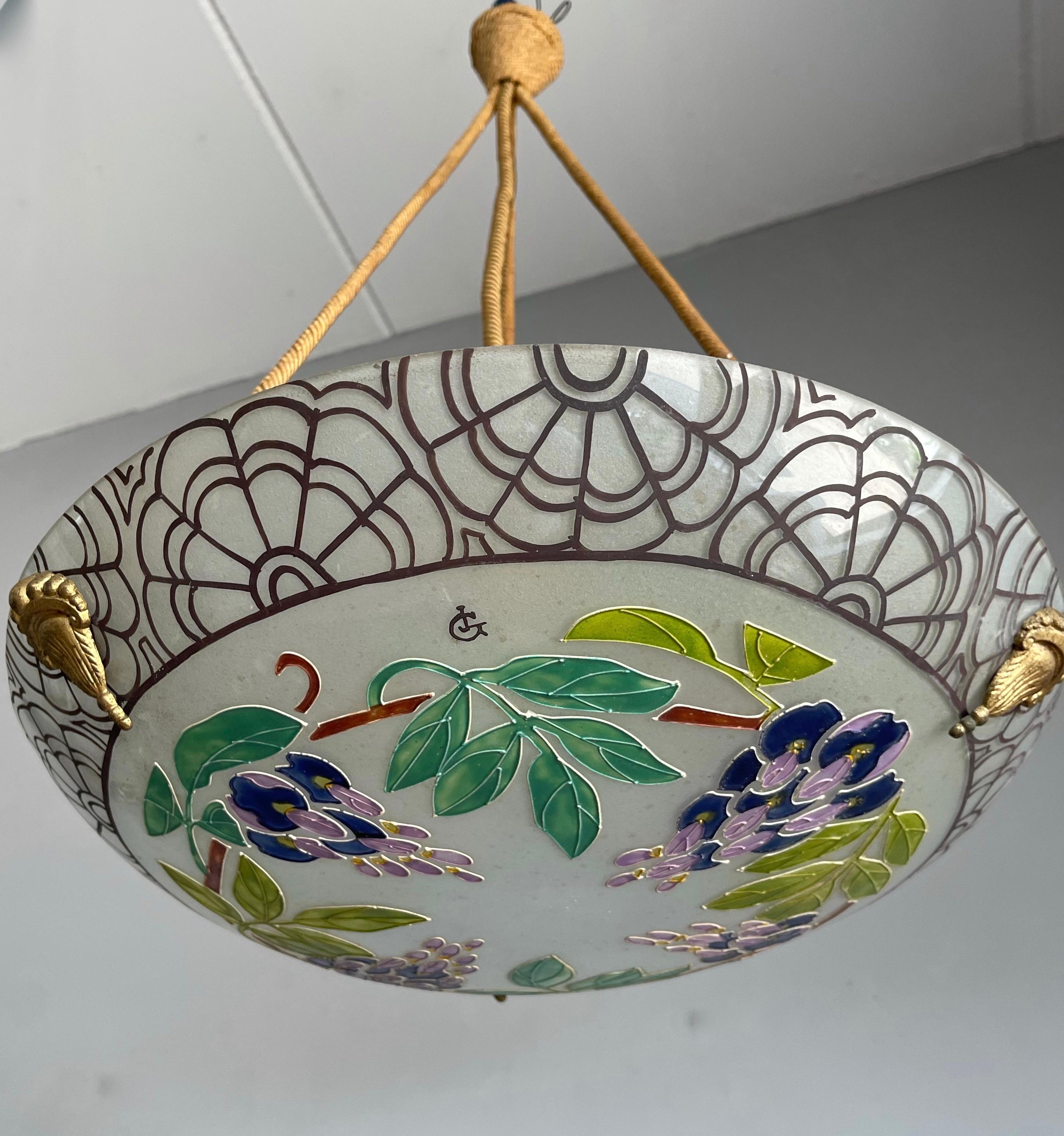 Rare and stunning work of lighting art in the manner of Loys Lucha.

The glass shande is marked with initials of the artist (picture 3 and 4).
If you are passionate about early 20th century decorative art then you will love this striking pendant.