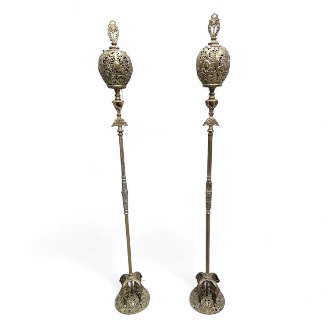 Antique Art Deco Oscar Bruno Bach Finest Detailed Figural Bronze Floor Lamps - Pair 

This exquisite pair of Antique Art Deco floor lamps, crafted by the renowned Oscar Bruno Bach, showcases the finest detailed figural bronze work, featuring a rich
