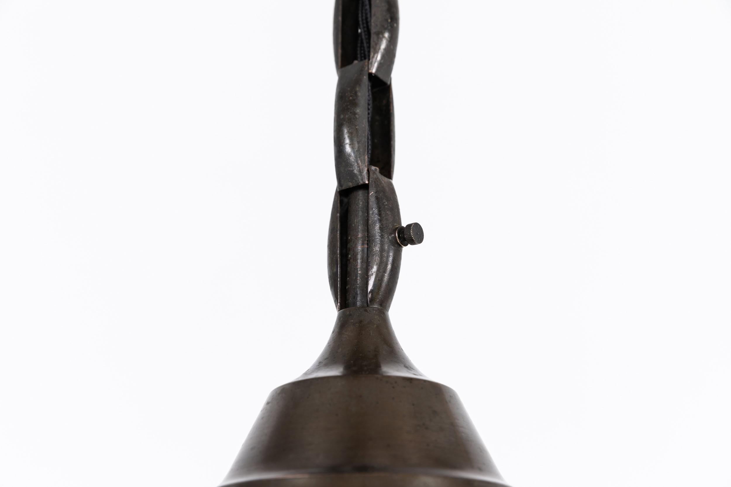 

An incredibly elegant conical opaline light made by Philips. c.1920

Manufactured in the Netherlands, a classic and timelessly designed pendant light. Opaline glass with original copper gallery and short length of chain. Remnants of makers mark