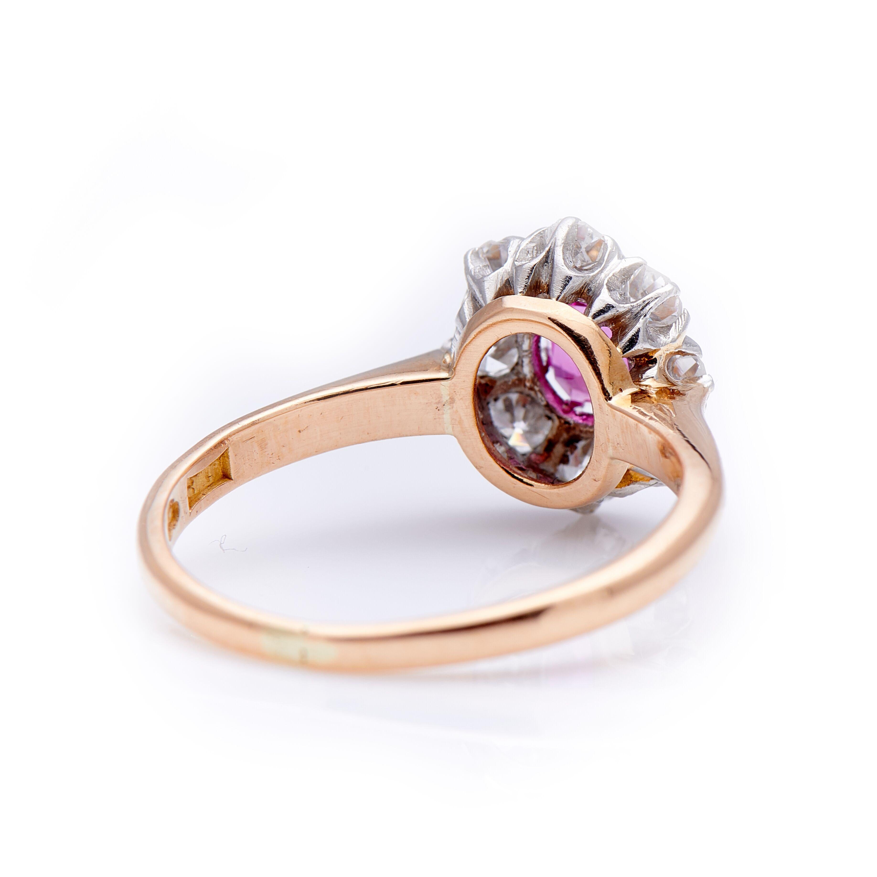 Art Deco, pink sapphire and diamond cluster ring, circa 1920. A very pretty pink sapphire centre with a delicate old-cut diamond surround all set in platinum style claw setting. The sapphire is vibrant shade of pink, a wonderful contrast to the