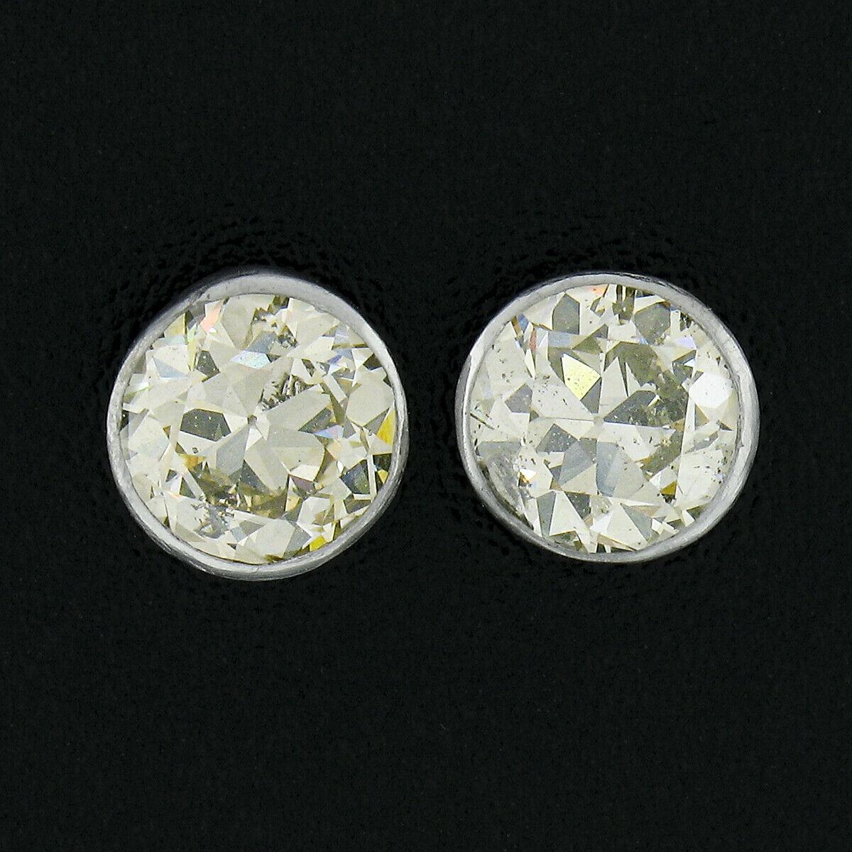 Here we have an outstanding pair of antique diamond stud earrings that were crafted from solid platinum during the art deco period. They feature a pair of genuine, antique, old European cut diamonds that weigh a total of approximately 1.16 carats in
