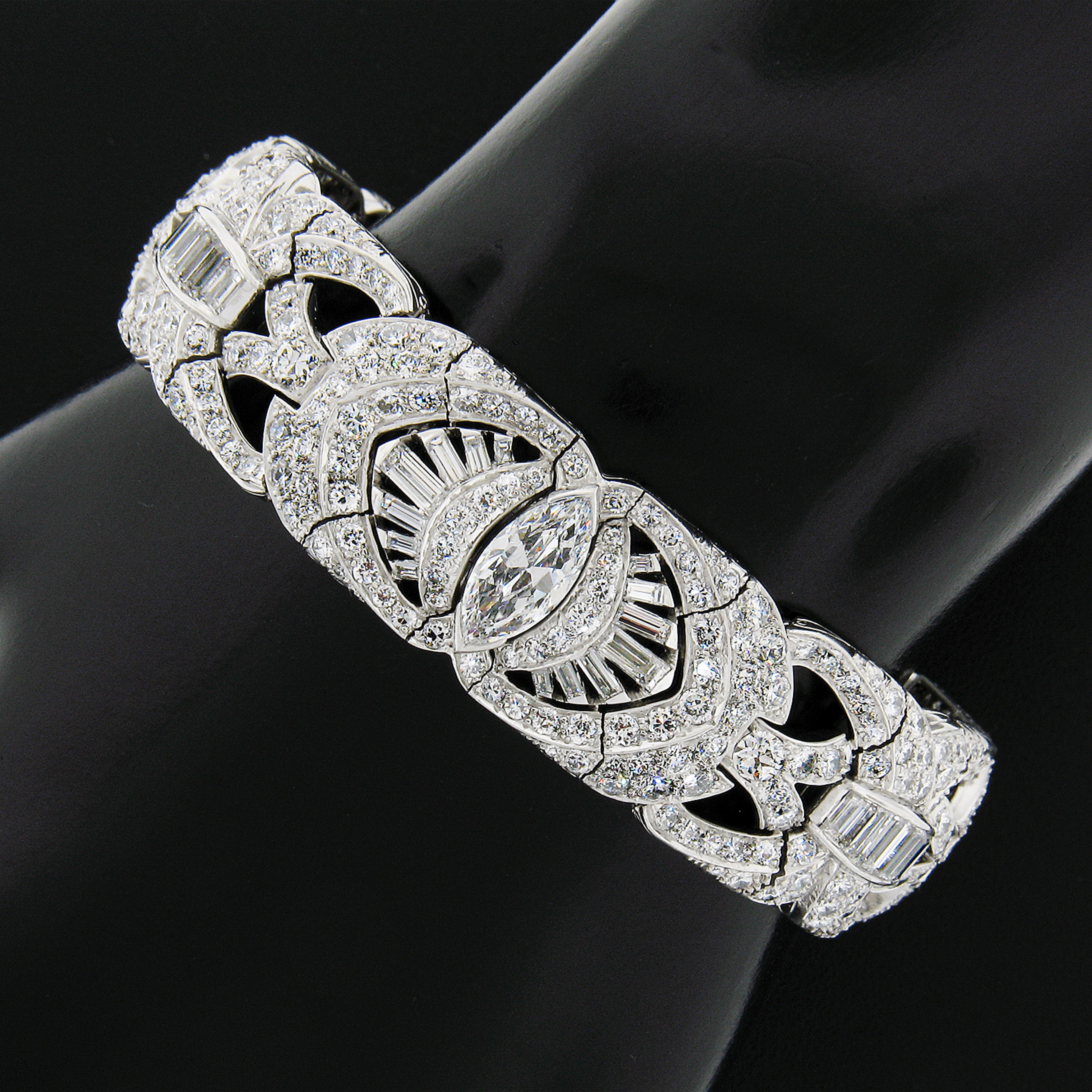 Here we have an absolutely jaw dropping, ALL ORIGINAL, antique art deco period bracelet crafted in solid platinum, and features rectangular links that are fully and elegantly drenched with old cut diamonds throughout. These old cut diamonds are
