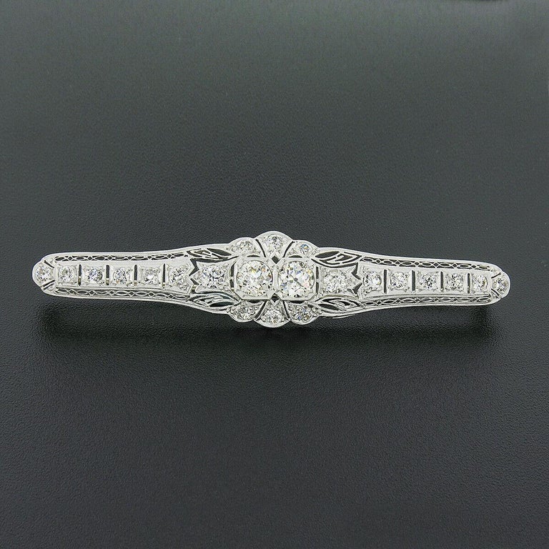 Here we have an absolutely stunning antique bar pin brooch that was crafted from solid platinum during the art deco period featuring fine diamonds throughout. The brooch is set with approximately 4.04 carats of old European cut diamonds with the