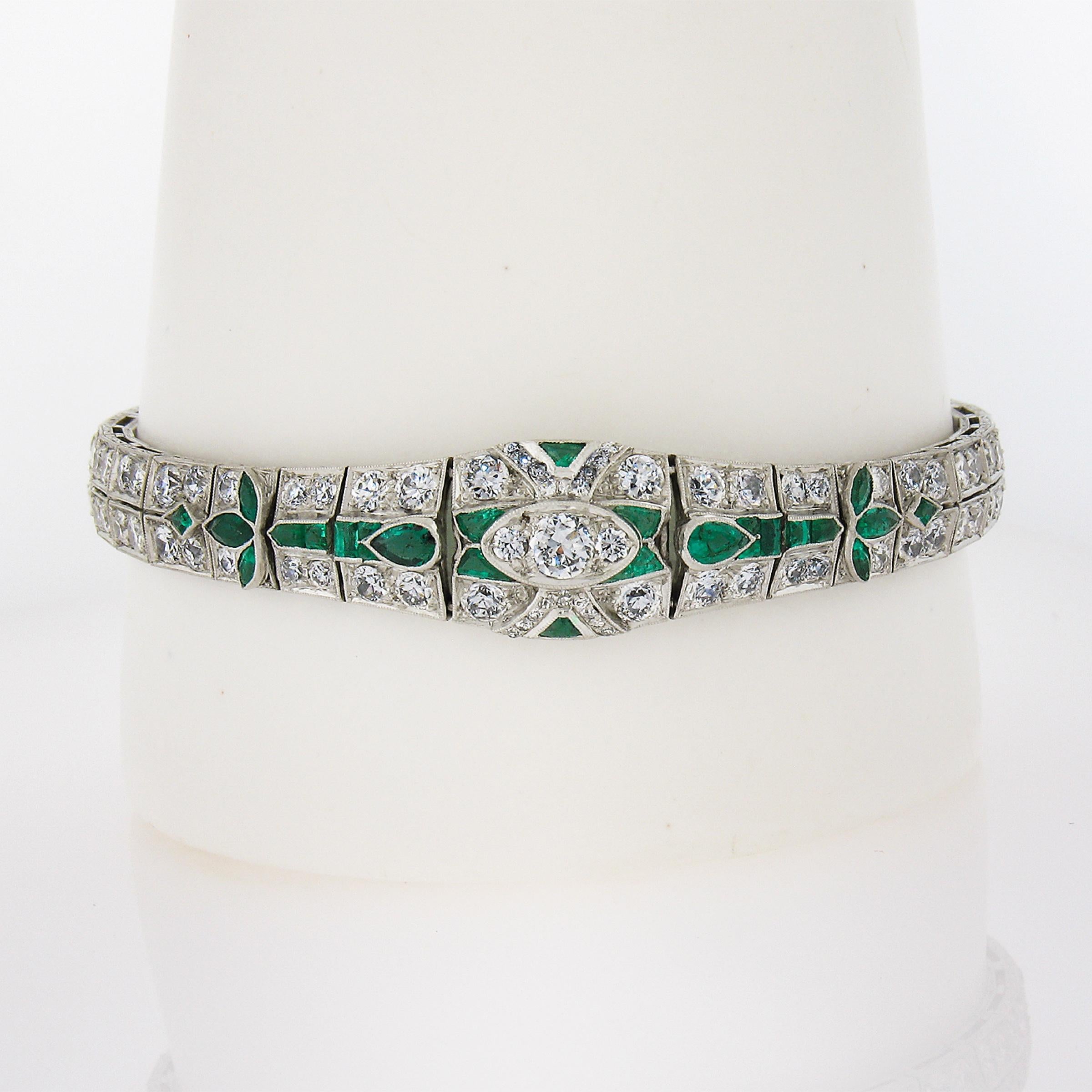 This incredible antique art deco period bracelet features a slightly graduated rectangular links that are elegantly encrusted with pave set old European diamonds throughout. These old cut diamonds are full of life and character with eye-catching