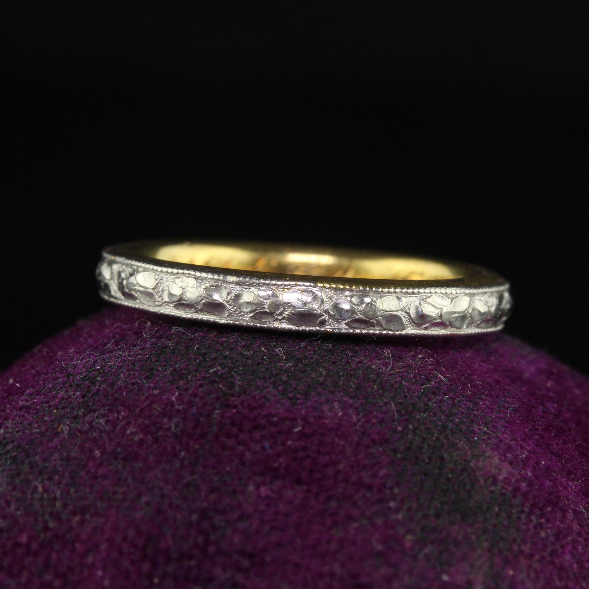 Beautiful Antique Art Deco Platinum and 18K Gold Engraved Wedding Band Circa 1917 - Size 5 1/2. This gorgeous wedding band is crafted in 18k yellow gold and platinum. The floral engravings go around the entire ring and are in crisp condition. The