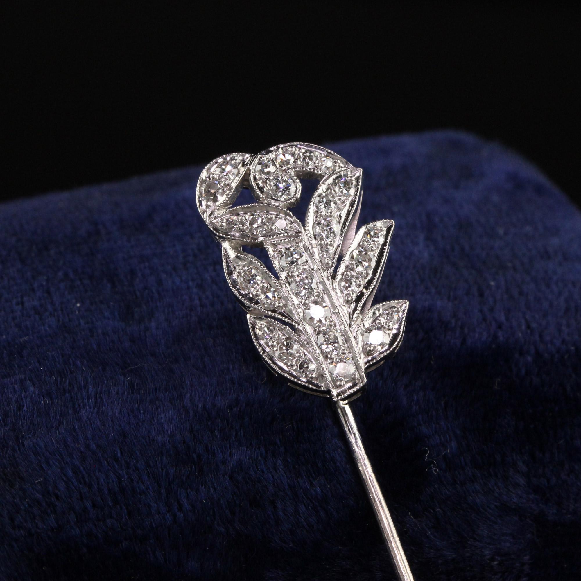 Beautiful Antique Art Deco Platinum and 18K White Gold Old Euro Diamond Floral Stick Pin. This gorgeous stick pin is crafted in platinum and 18k white gold. The floral section of the pin is platinum and the pin section is 18k white gold. There are