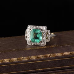 Antique Art Deco Platinum and 18 Karat Gold Diamond and Emerald Cocktail Ring