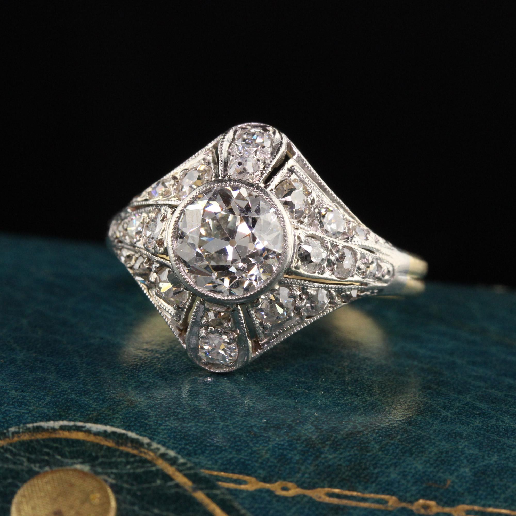 Beautiful Antique Art Deco Platinum and Yellow Gold Old European Diamond Engagement Ring. This magnificent engagement ring is crafted in platinum and 18k yellow gold grooved shank. The center is an bright and white old European cut diamond and is