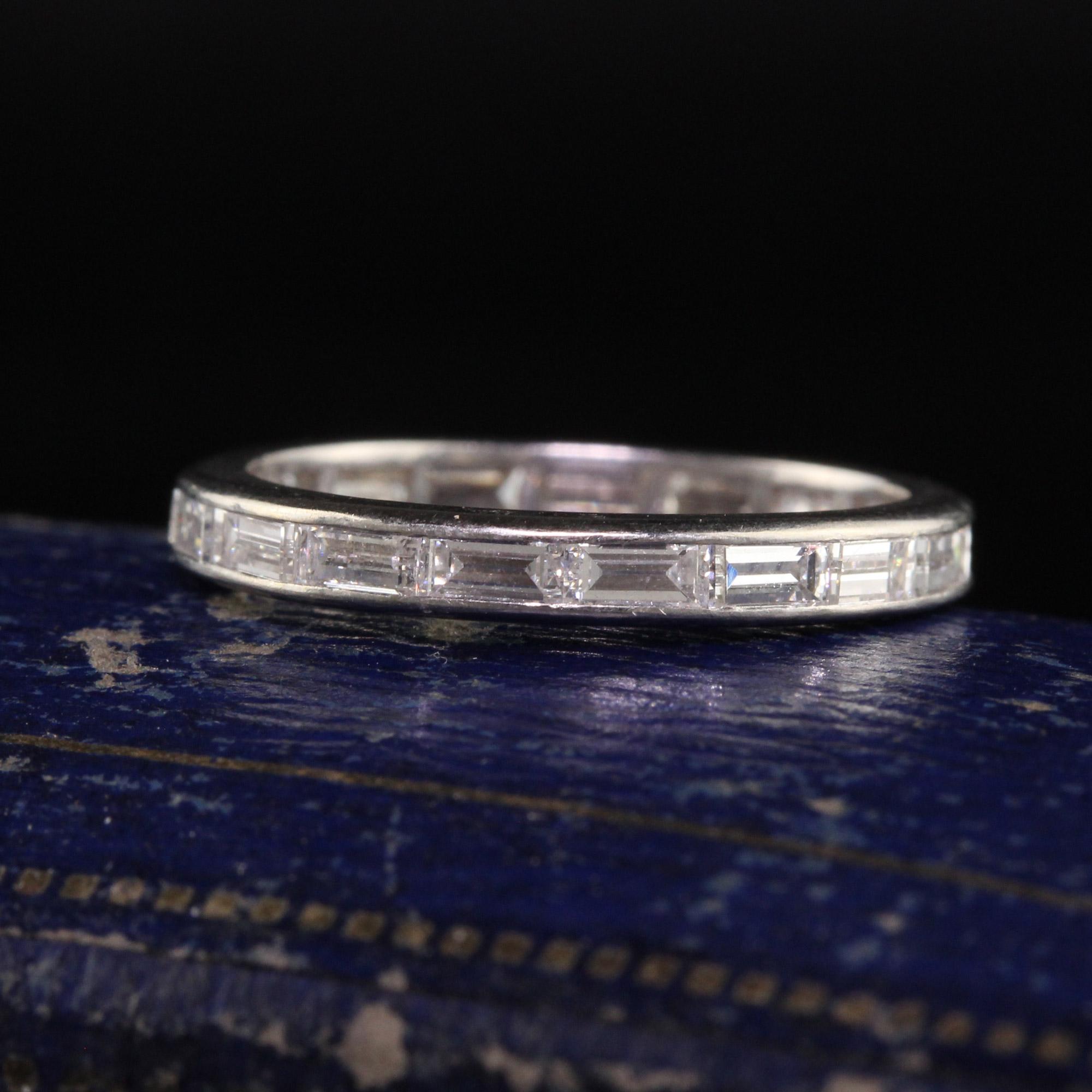 Beautiful Antique Art Deco Platinum Baguette Diamond Eternity Band - Size 5 1/4. This beautiful band is crafted in platinum. It has baguette diamonds going around the entire ring and is in good condition.

Item #R1355

Metal: Platinum

Weight: 2.1