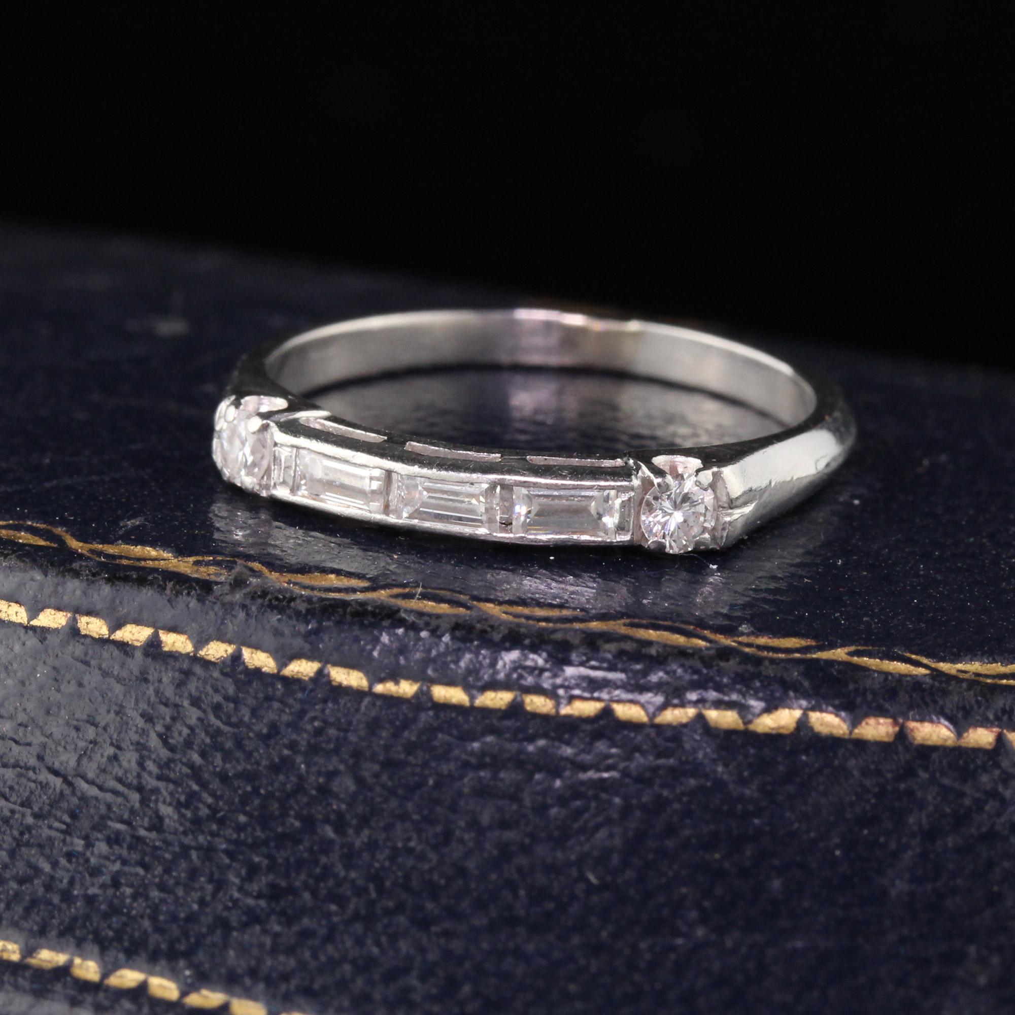 Deco Platinum half eternity band with 3 baguette cut diamonds set horizontally and a single cut diamond on either side. Classic!

#R0334

Metal: Platinum

Weight: 3.1 Grams

Total Diamond Weight: Approximately 0.40 cts diamonds

Diamond Color:
