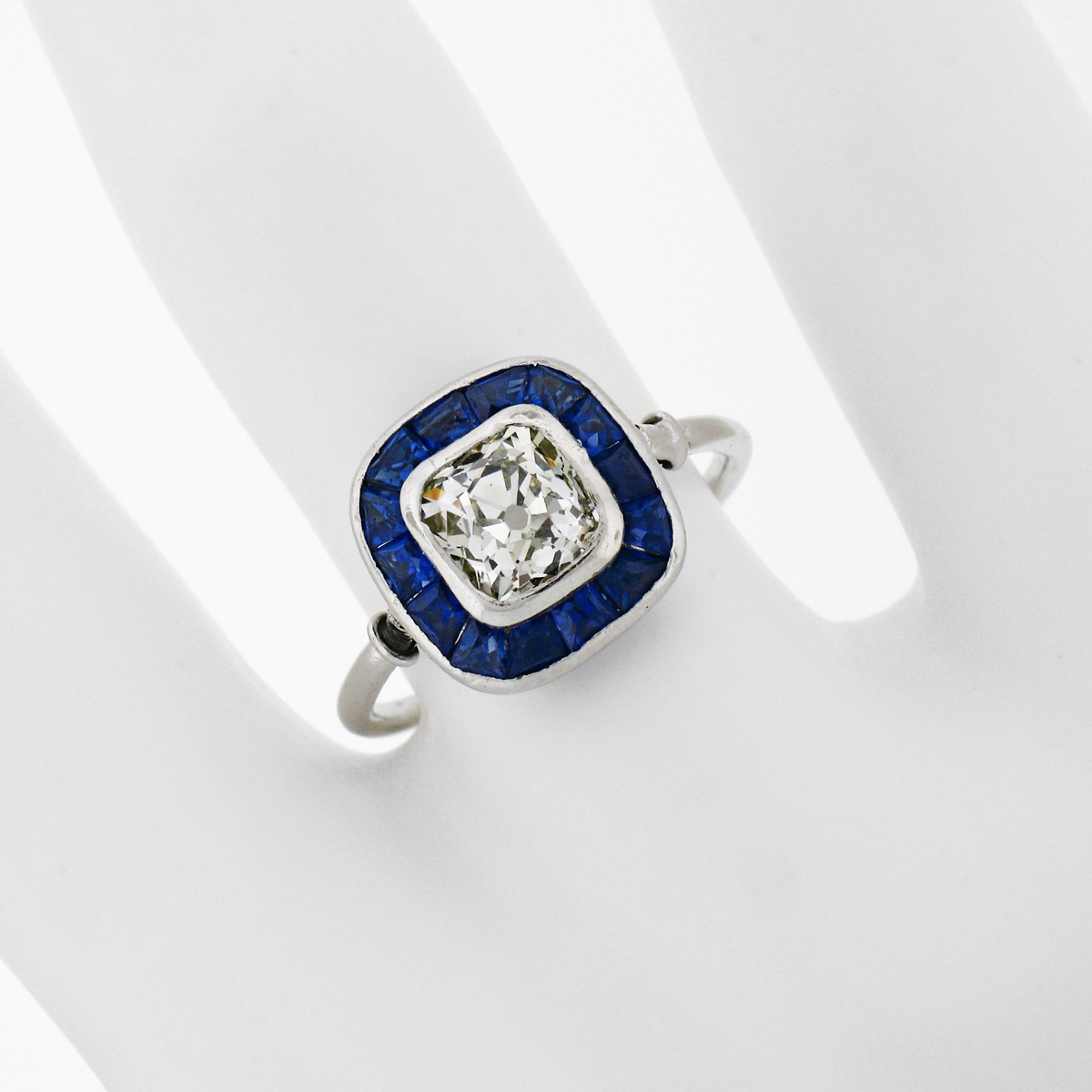 Antique Art Deco Platinum Bezel Old Mine Cushion Diamond & Sapphire Halo Ring In Good Condition For Sale In Montclair, NJ