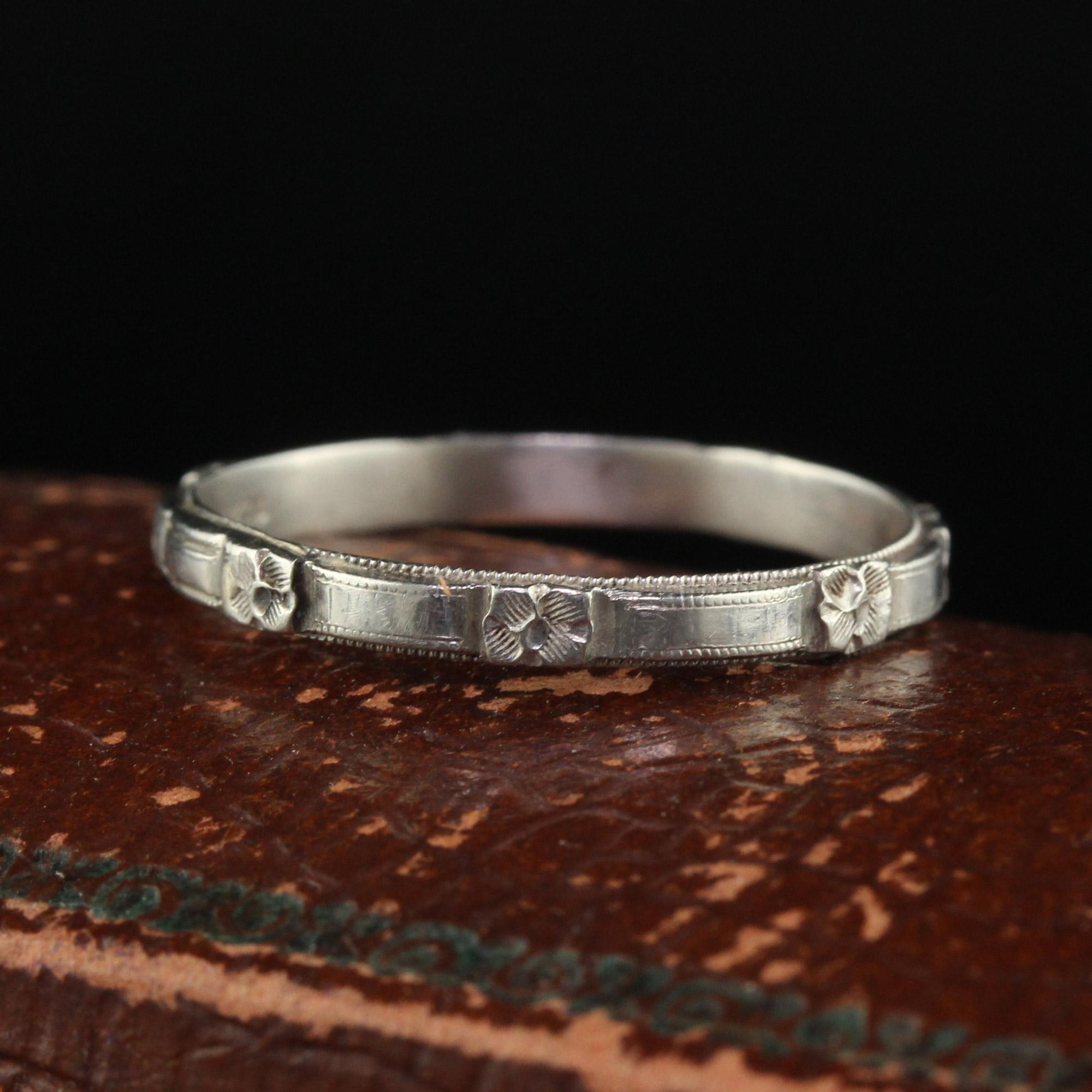 Beautiful Antique Art Deco Platinum Blossom Engraved Wedding Band - Size 8. This beautiful wedding band is crafted in platinum. There are crisp engravings of a blossom design going around the band and it is in great condition. The ring sits low on