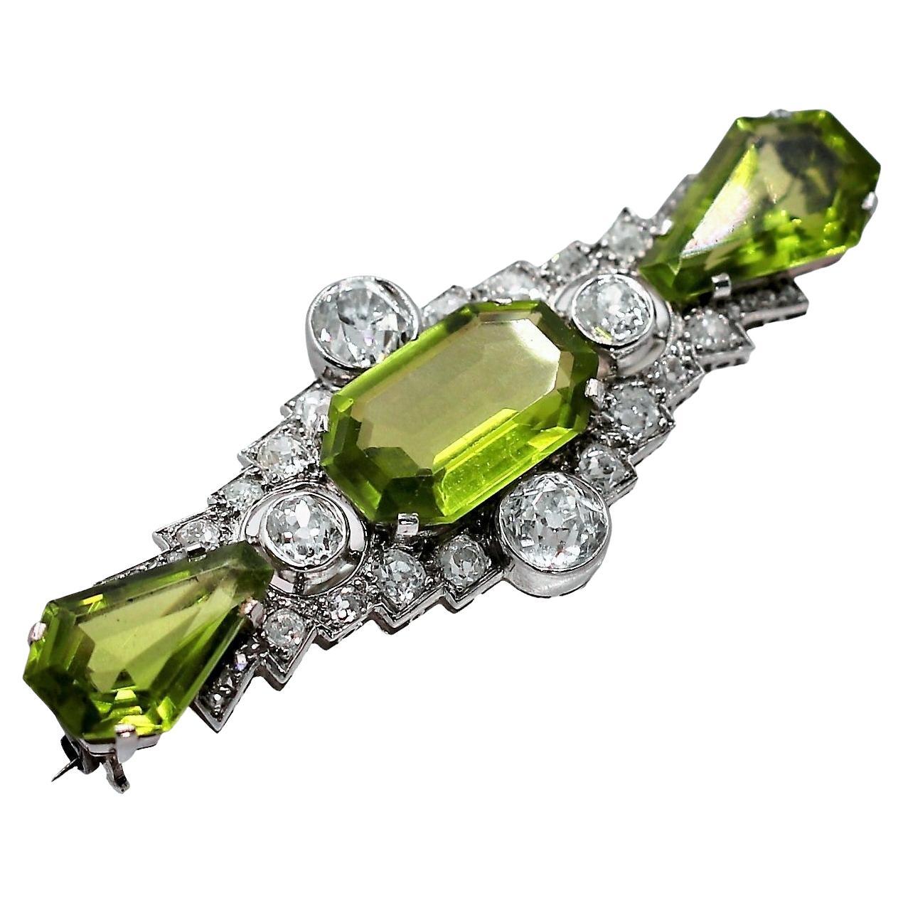 Antique Art Deco Platinum Brooch with Diamonds and Peridot For Sale