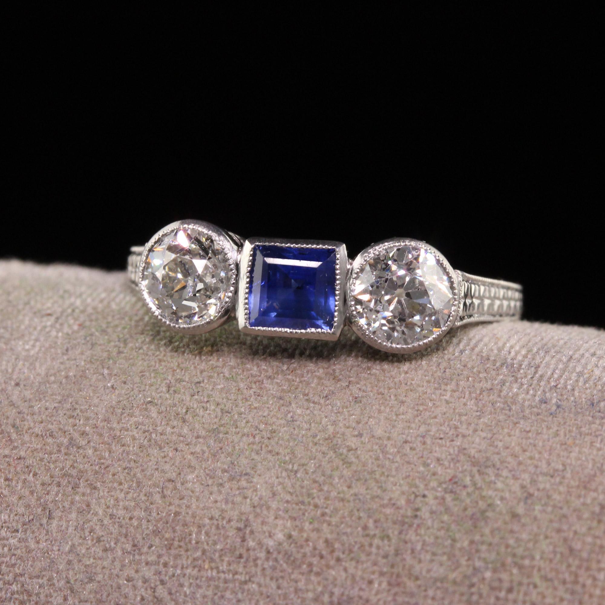 Beautiful Antique Art Deco Platinum Burma No Heat Sapphire Diamond Three Stone Ring - GIA. This beautiful ring is crafted in platinum. The ring features a natural Burma untreated sapphire in the center and has two old european cut diamonds set in a