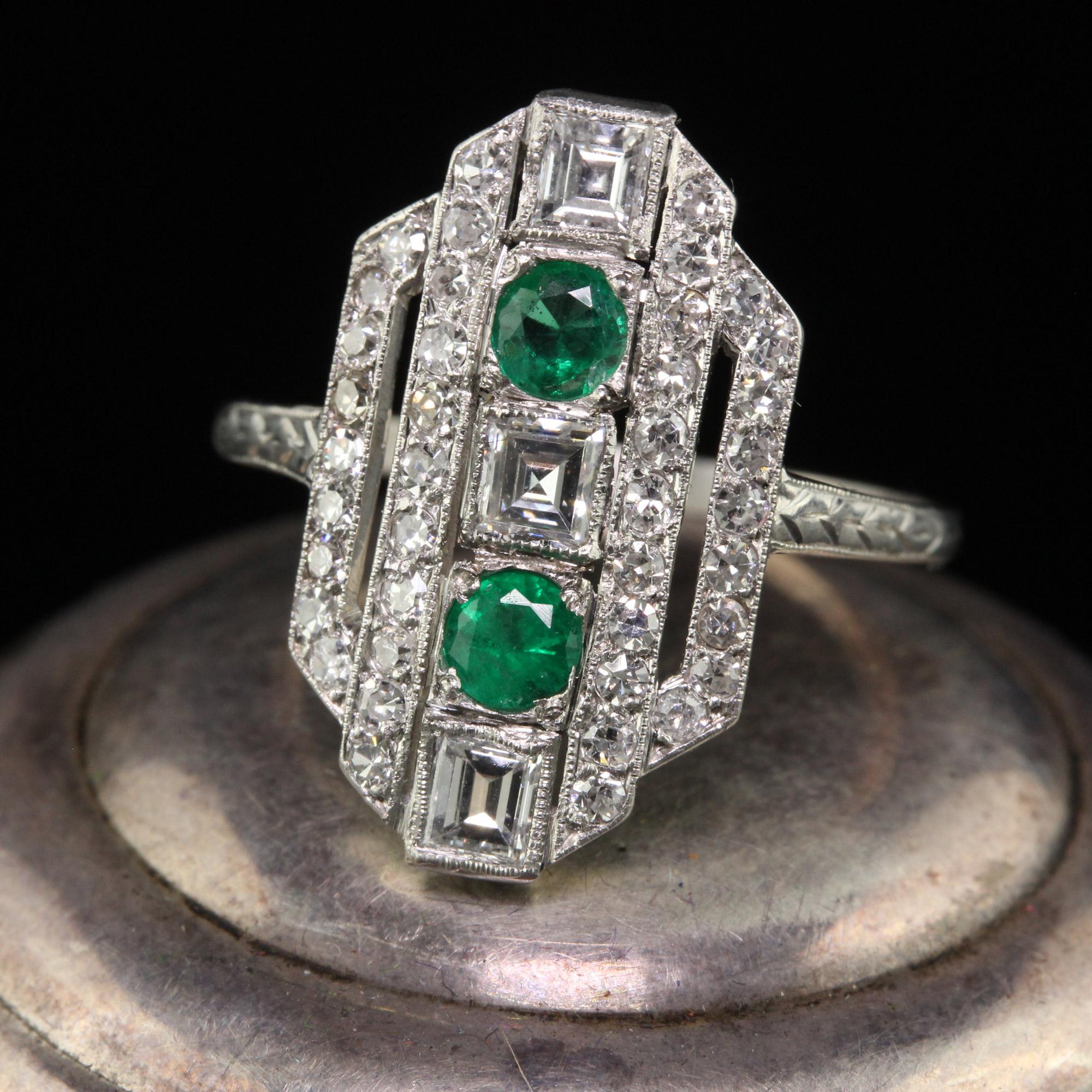 Beautiful Antique Art Deco Platinum Carre Cut Diamond and Emerald Shield Ring - Size 6 3/4. This incredible shield ring is crafted in platinum. The ring has beautiful single cut diamonds, carre cut diamonds, and Colombian emeralds. This gorgeous