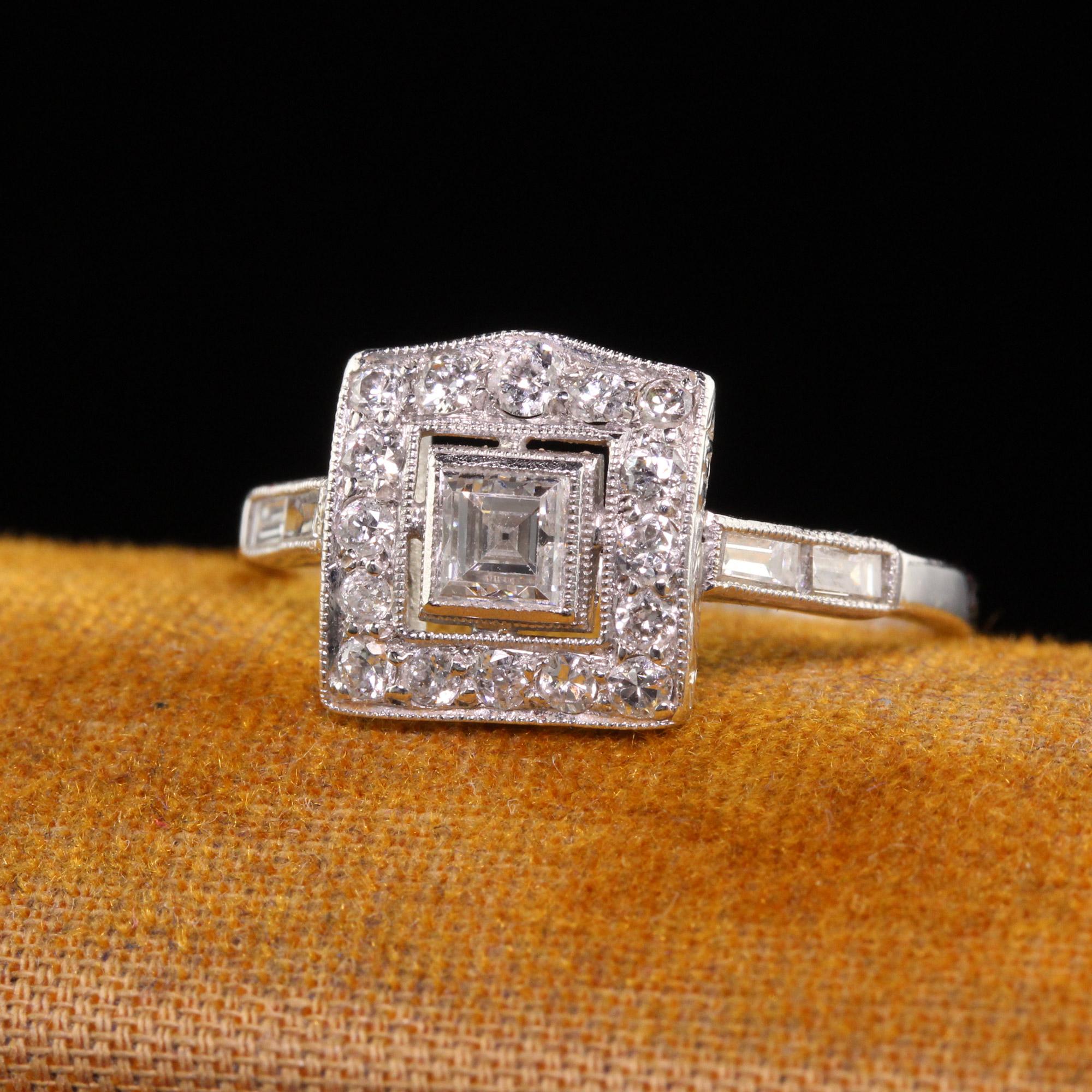 Beautiful Antique Art Deco Platinum Carre Cut Old European Diamond Engagement Ring. This beautiful engagement ring is crafted in platinum. The center holds a carre cut diamond and is surrounded by old european cut diamonds. This ring has an