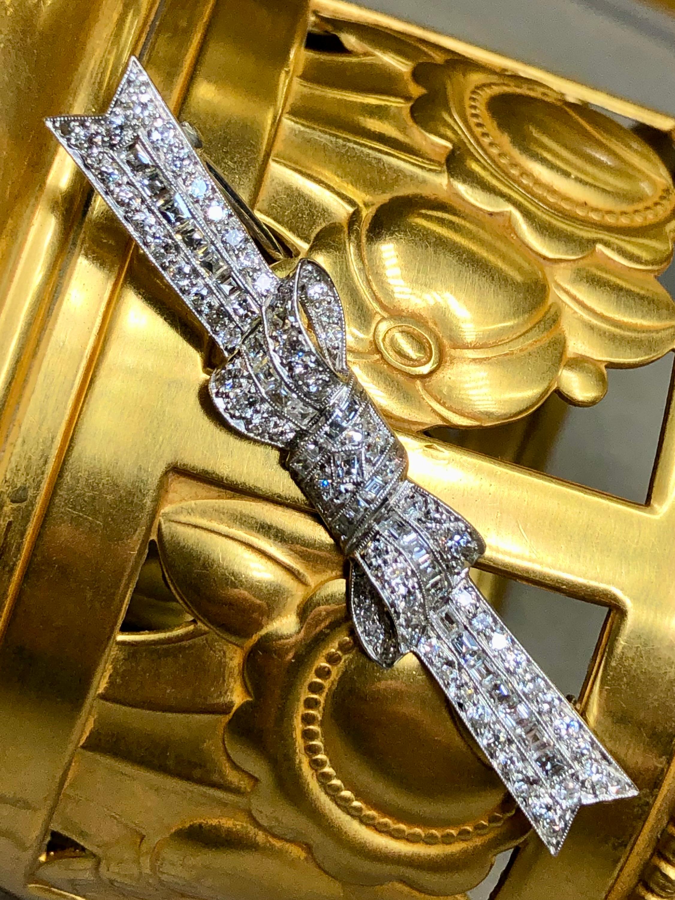 This fabulously original Art Deco bow pin is crafted in platinum (pin is 14K white gold) and set with both all original old European cut as well as carre cut diamonds. All stones range G-H color and Vs1-2 clarity round. From diamond setting to metal