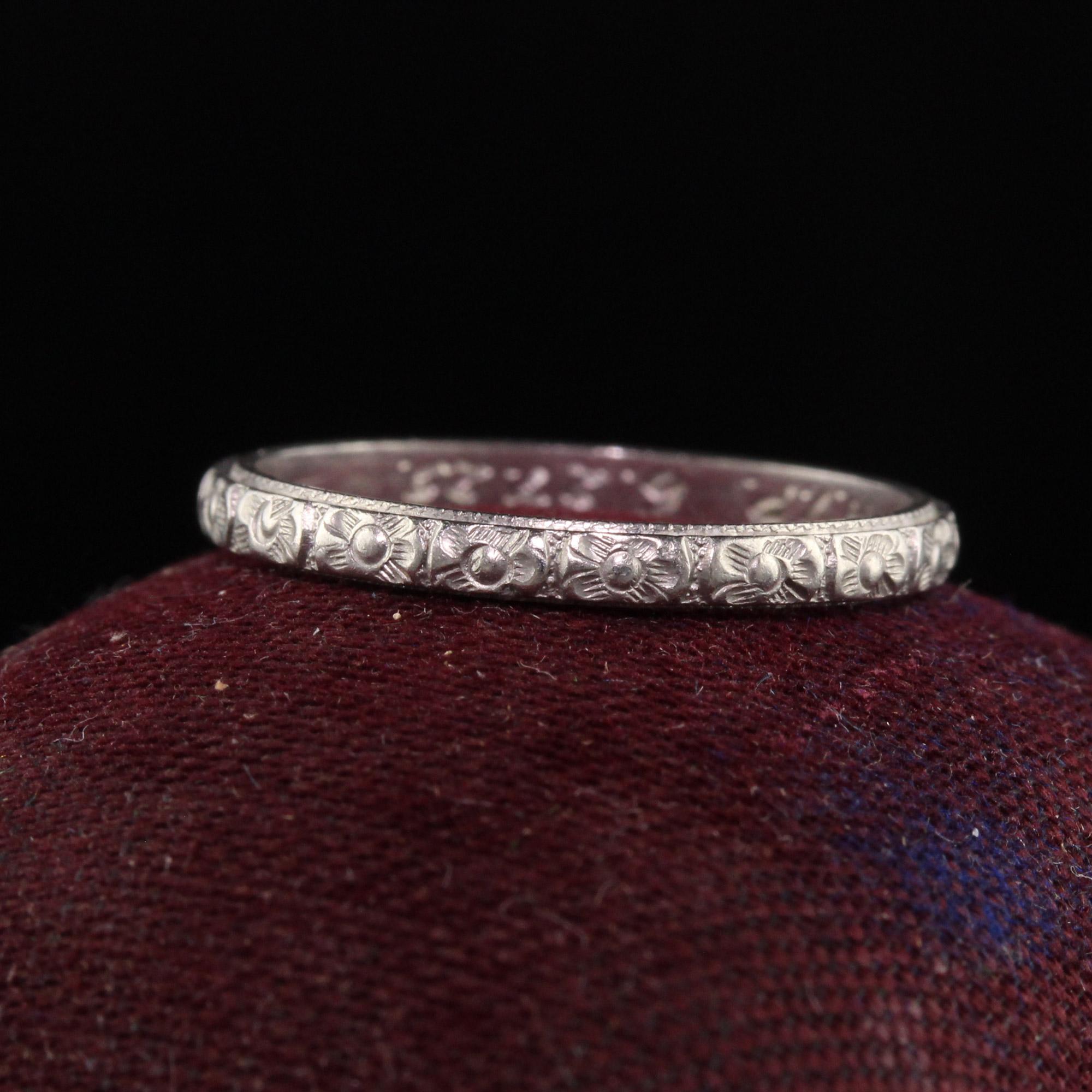 Beautiful Antique Art Deco Platinum Classic Flower Engraved Wedding Band. This incredible wedding band is crafted in platinum and has beautiful flower engravings around the entire wedding band and has A. M. R to H. V. P. 6-27-25