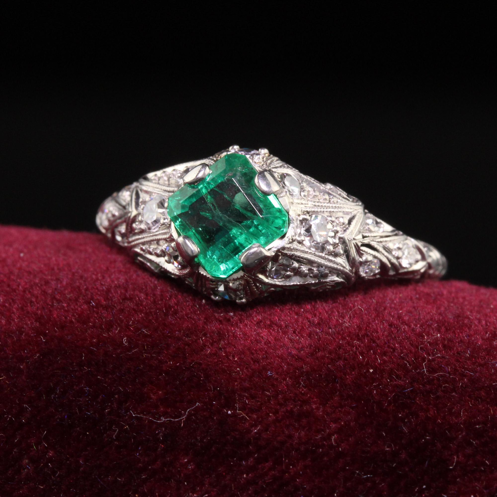 Beautiful Antique Art Deco Platinum Colombian Emerald Diamond Filigree Engagement Ring. This gorgeous engagement ring is crafted in platinum. The ring holds a genuine Colombian emerald with a GIA report in the center and has single cut diamonds set