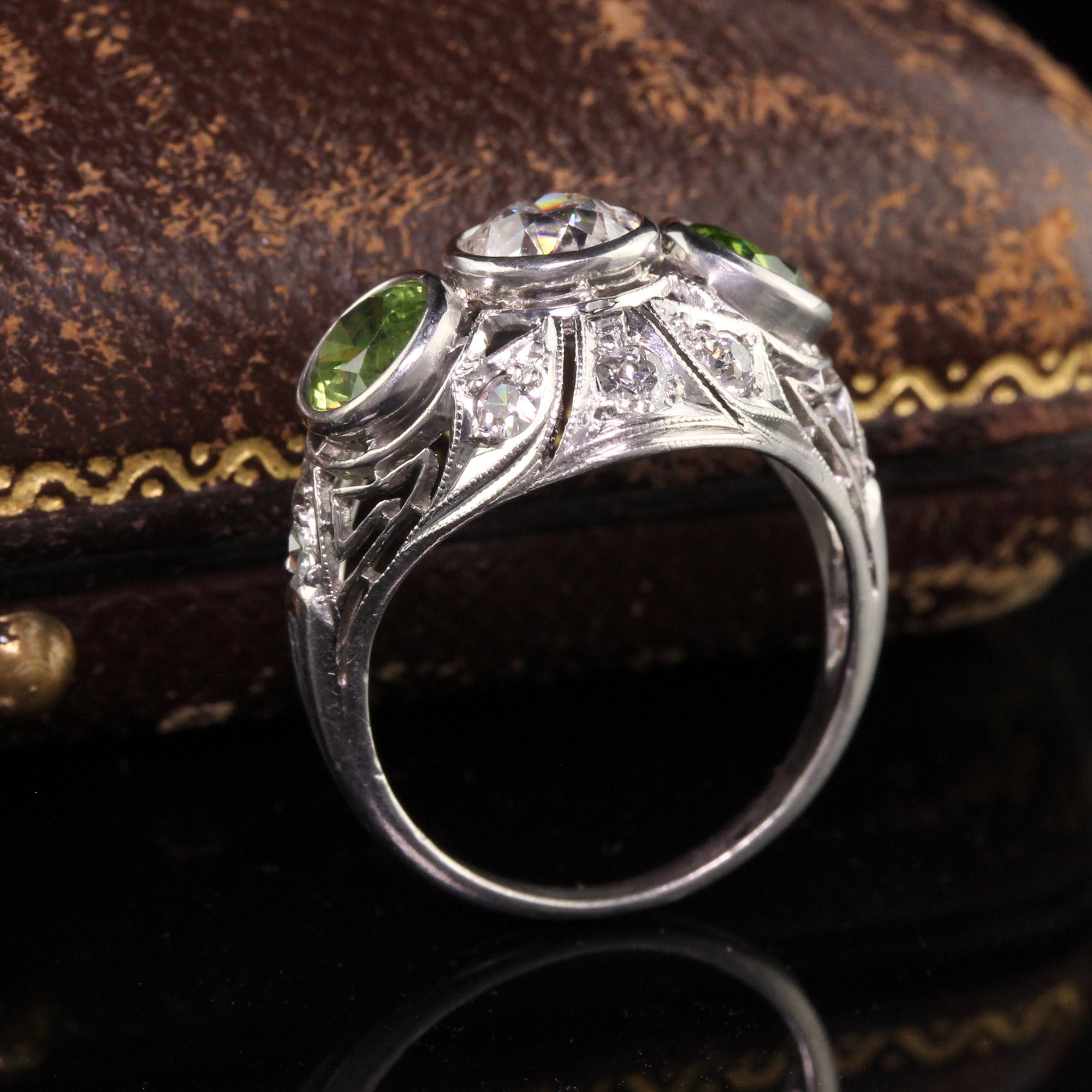 Antique Art Deco Platinum Demantoid Garnet and Diamond Three Stone Ring In Good Condition For Sale In Great Neck, NY