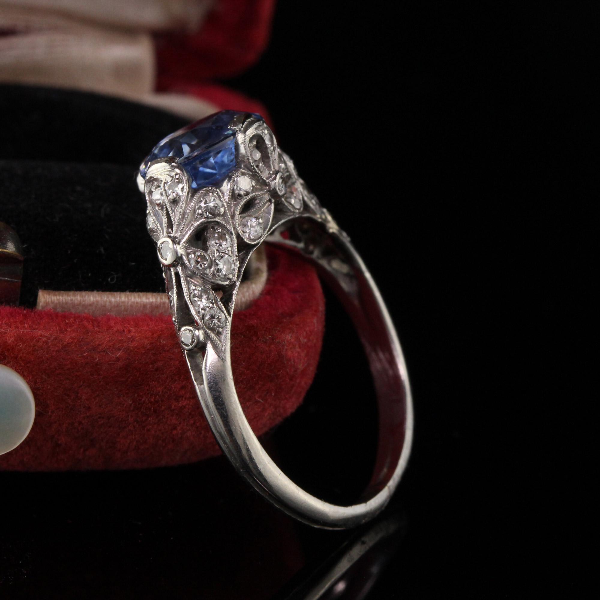 Stunning antique engagement ring with diamonds and a gorgeous sapphire center. 

Item #R0534

Metal: Platinum

Weight: 5.9 Grams

Total Diamond Weight: Approximately 1.00 cts

Diamond Color: H

Diamond Clarity: VS2

Center Sapphire Weight: 3.24