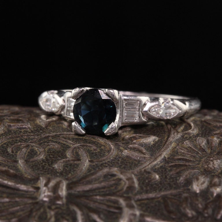 Beautiful Antique Art Deco Platinum Diamond and Sapphire Engagement Ring. This gorgeous engagement ring has old cut marquise and baguettes on the ring with a round sapphire in the center.

Item #R0978

Metal: Platinum

Weight: 4 Grams

Diamonds: