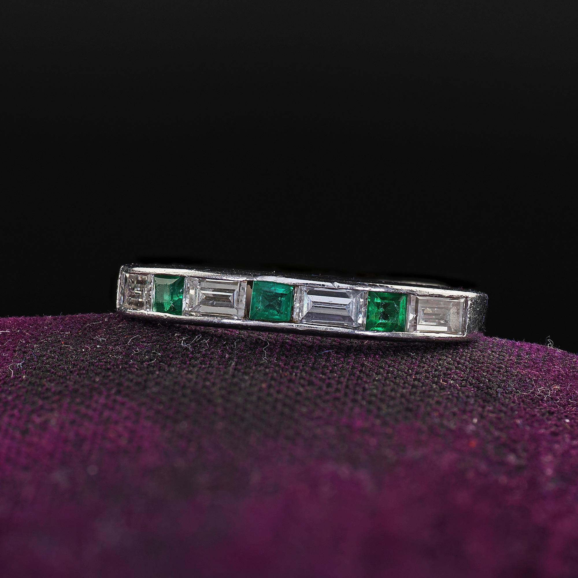 Beautiful Antique Art Deco Platinum Diamond Baguette and Emerald Wedding Band - Size 3 3/4. This amazing Art Deco diamond and emerald wedding band is crafted in platinum. This ring features old cut baguettes and square cut emeralds alternating half