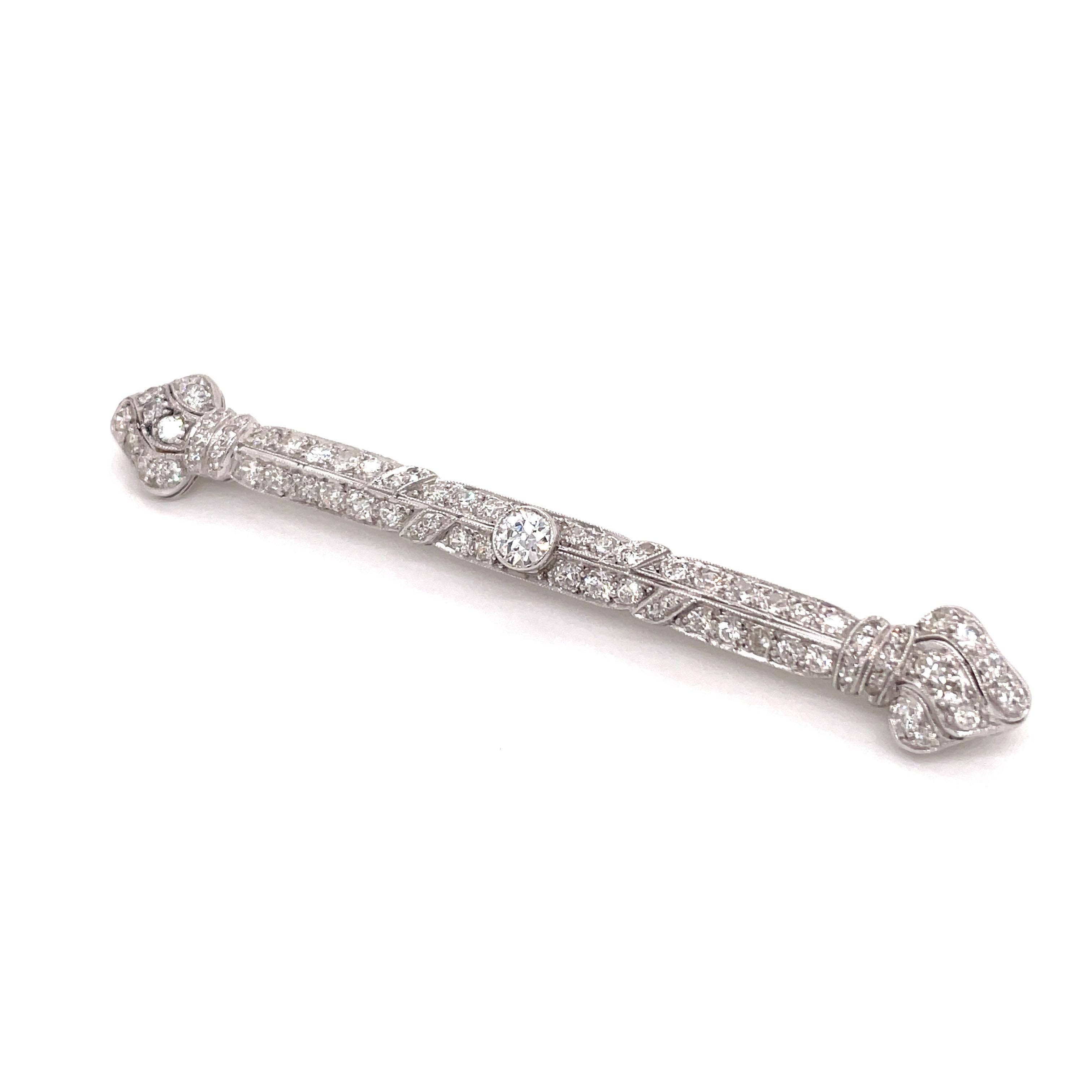 This exceptional antique bar pin is a stunning representation of the Art Deco era's elegant sophistication and unparalleled craftsmanship. Rendered in lustrous platinum, it showcases a sleek and streamlined design that epitomizes the period's
