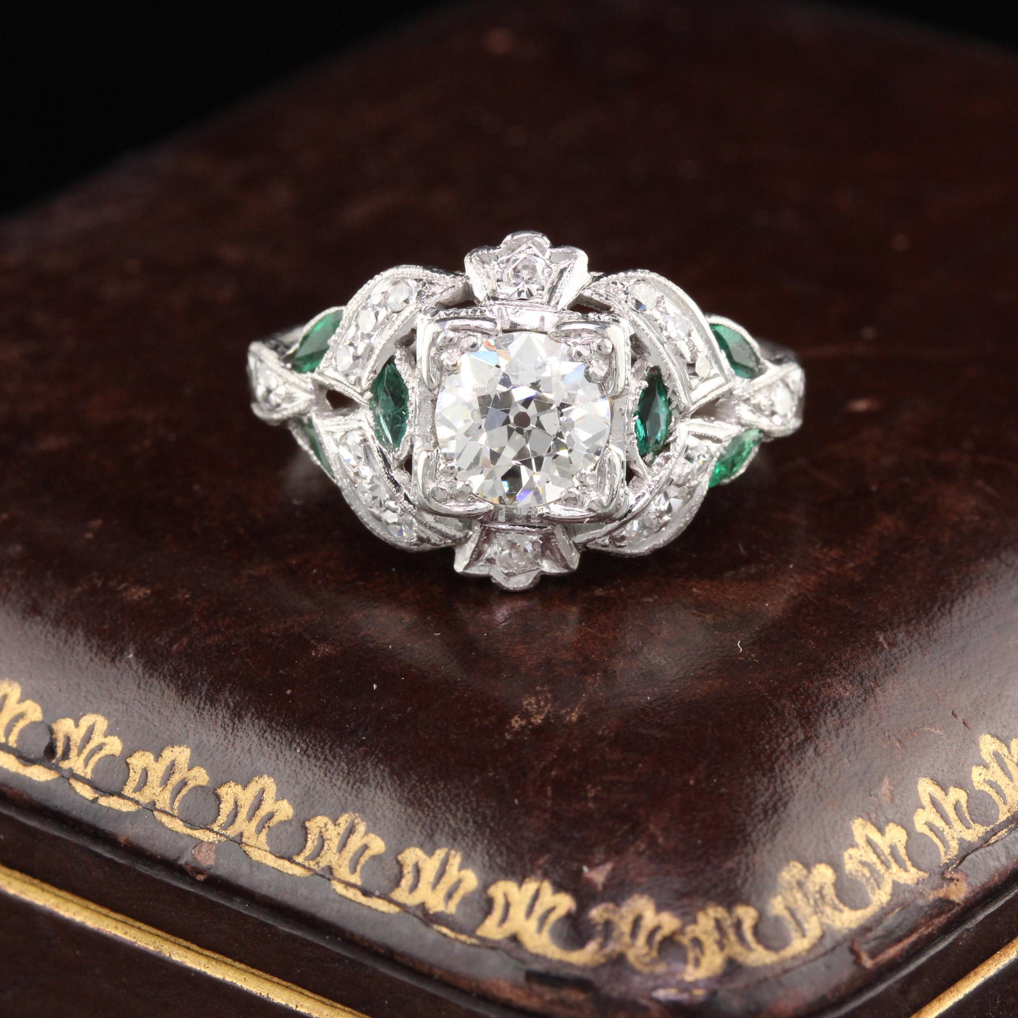 Gorgeous Art Deco engagement ring done in platinum with an old european cut diamond in the center in a diamond and emerald mounting.

#R0255

Metal: Platinum

Weight: 4.1 Grams

Center Diamond Weight: Approximately 0.90 cts 

Center Diamond Color: