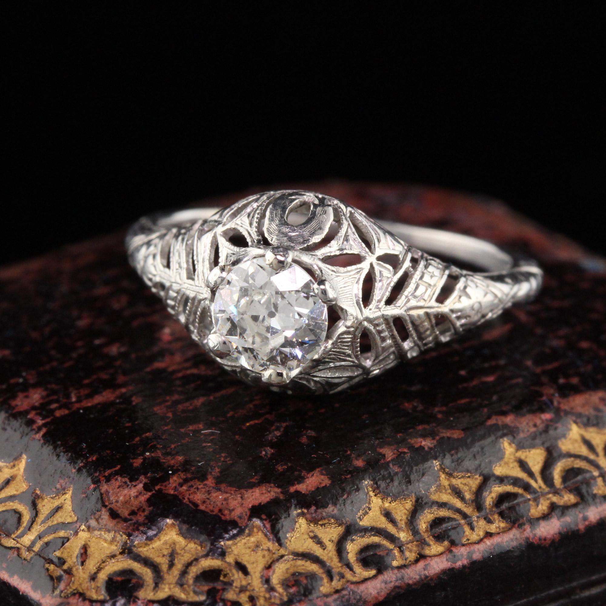 Beautiful Art Deco engagement ring in platinum with filigree!

#R0189

Metal: Platinum

Weight: 2.4 Grams

Center Diamond Weight: Approximately 0.45 ct Old European cut diamond

Center Diamond Color: H

Center Diamond Clarity: I2

Ring Size: 4 1/4