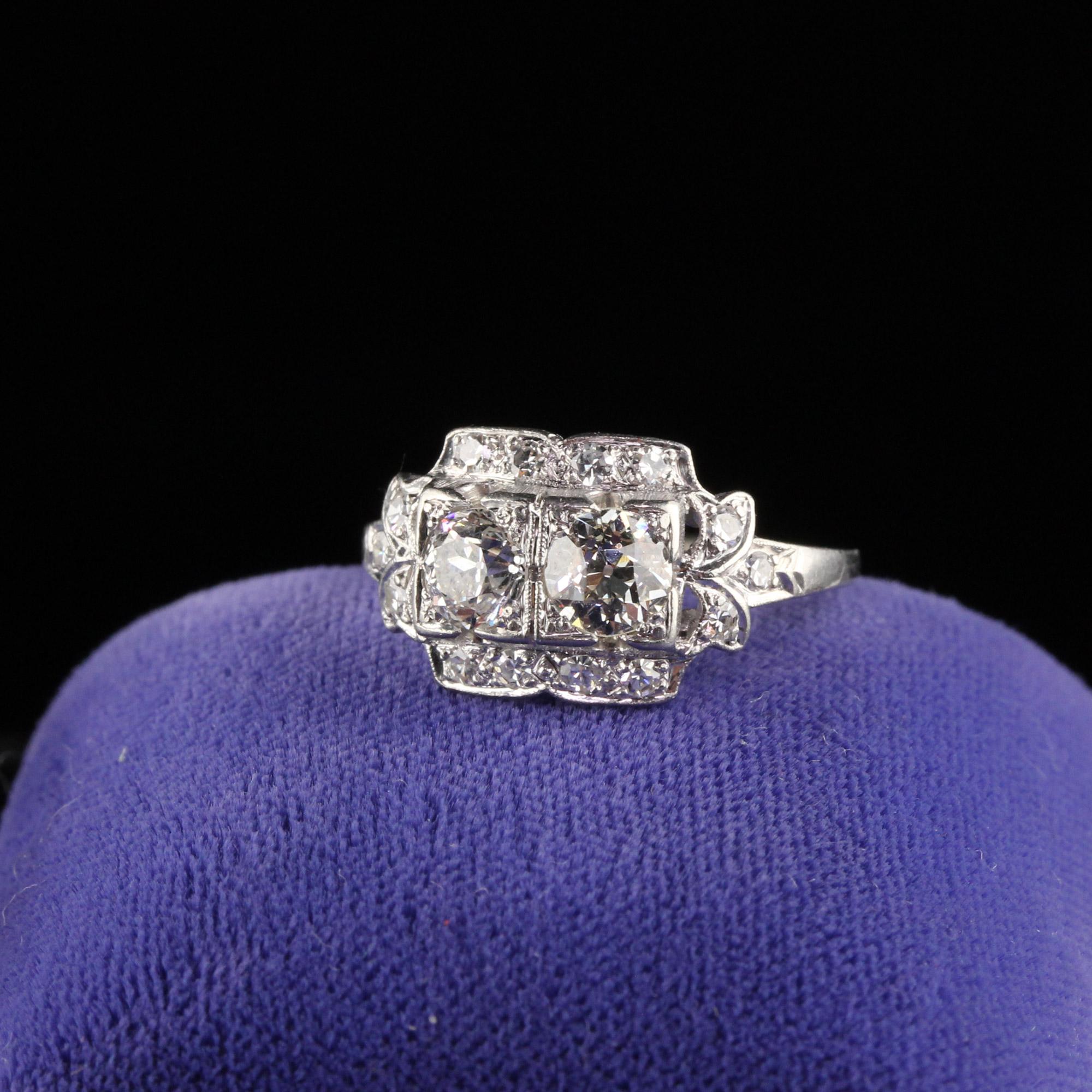 Beautiful Art Deco platinum Diamond engagement ring with two Old European shape diamonds in the center.

Item #R0448

Metal: Platinum

Weight: 3.5 Grams

Center Diamond Weight: Approximately 0.75 cts 

Total Diamond Weight: Approximately 1.00  cts