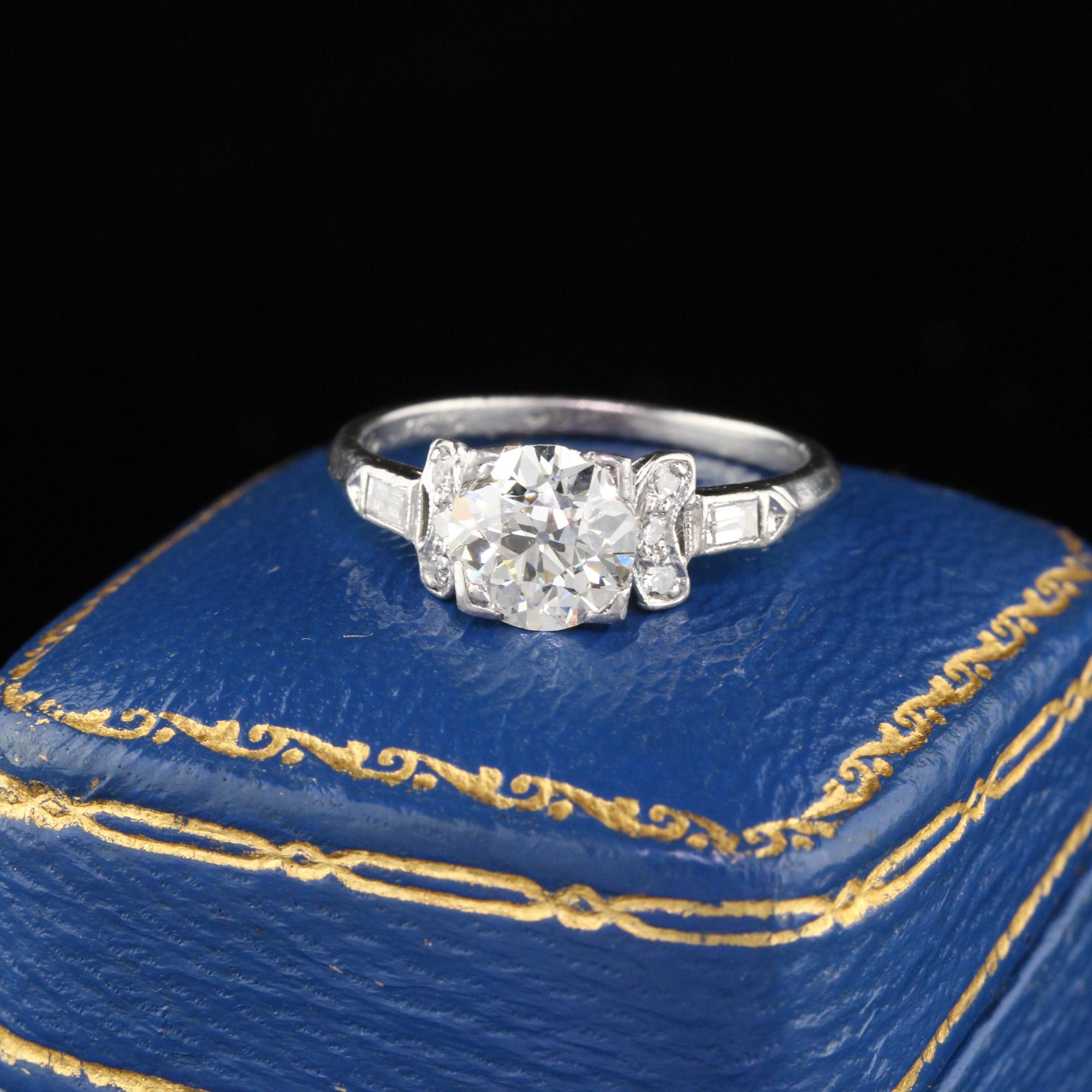 Gorgeous Art Deco Engagement Ring in platinum with an old european cut diamond in the center in a stunning mounting. 3 single cut diamonds & 1 baguette cut diamond are set on either side of the center.

#R0302

Metal: Platinum

Weight: 3.2
