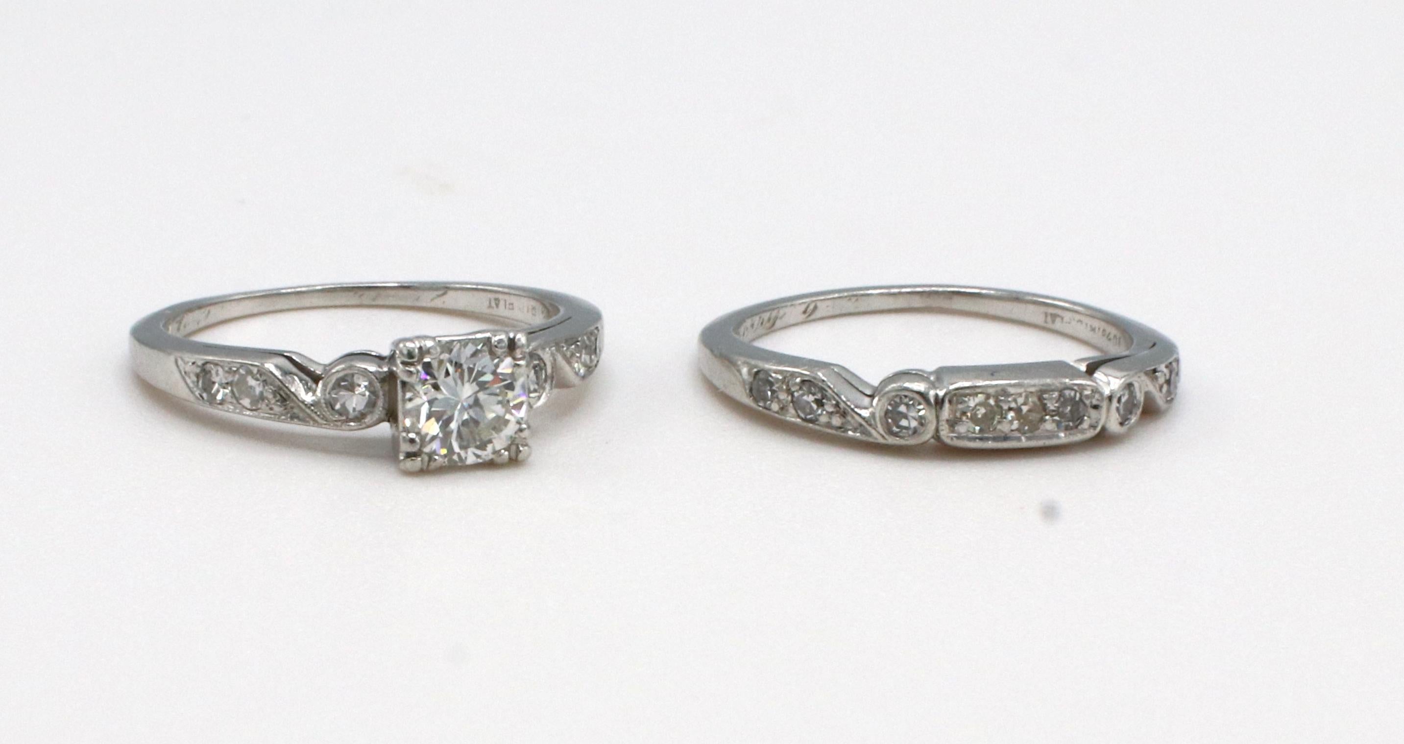 Antique Art Deco Platinum Diamond Engagement Ring & Wedding Band Set 
Metal: Platinum
Weight: 6.6 grams
Diamond: Approx. .50 carat I VS round diamond
Accent diamonds: Approx. .16 CTW I VS round diamonds
Size: 5.5 (US)
Note: Original engraving inside