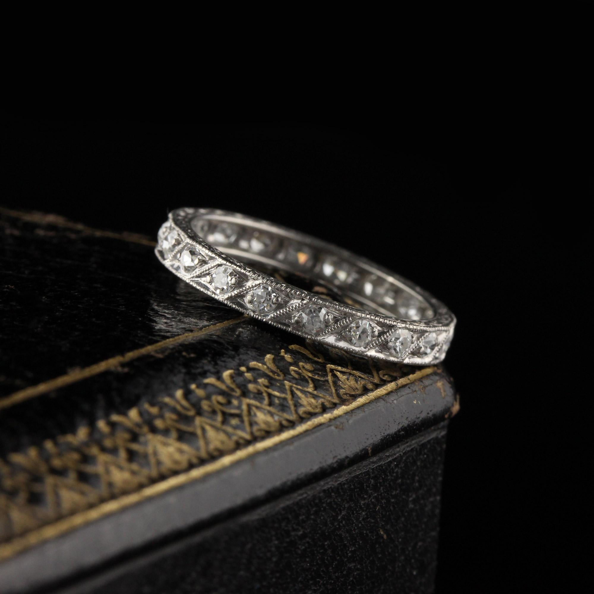 Stunning Art Deco platinum diamond eternity band with beautiful engravings on the side of the band. 

#R0422

Metal: Platinum

Weight: 2.1 Grams

Total Diamond Weight: Approximately 0.80 CTS

Diamond Color: H

Diamond Clarity: VS2 - SI1

Ring Size: