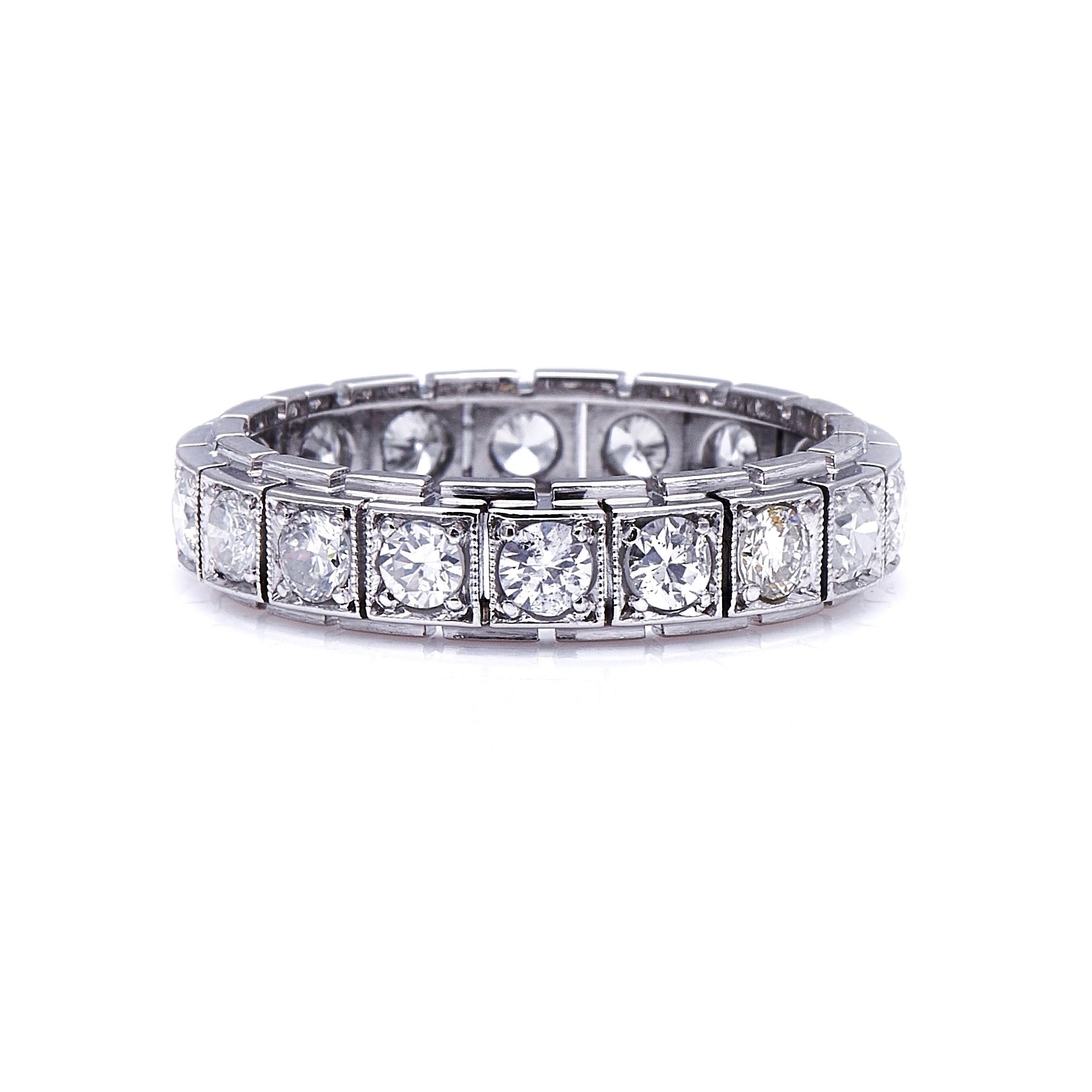 Diamond eternity ring, 1930s. Diamond eternity rings are so-called because they are set with a continuous band of diamonds, and symbolise never-ending love. This example is unusual for its segmented construction and its square millegrained borders