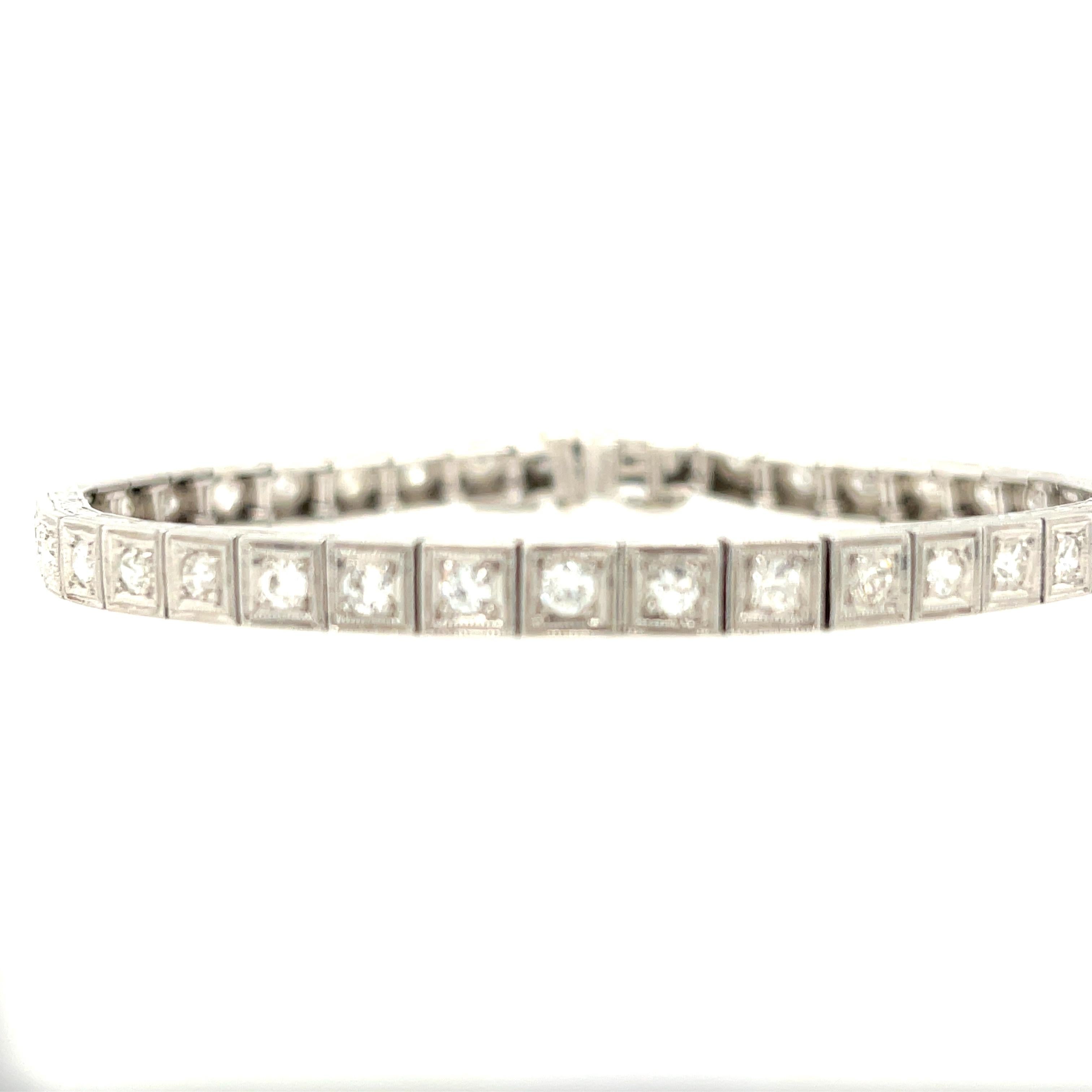 An antique Art Deco Diamond platinum line bracelet set with old European cut diamonds, circa 1920. The bracelet has 41 diamonds weighing approximately 2.50 carats total. The bracelet has beautiful engraved sides that is Indicative of the period.