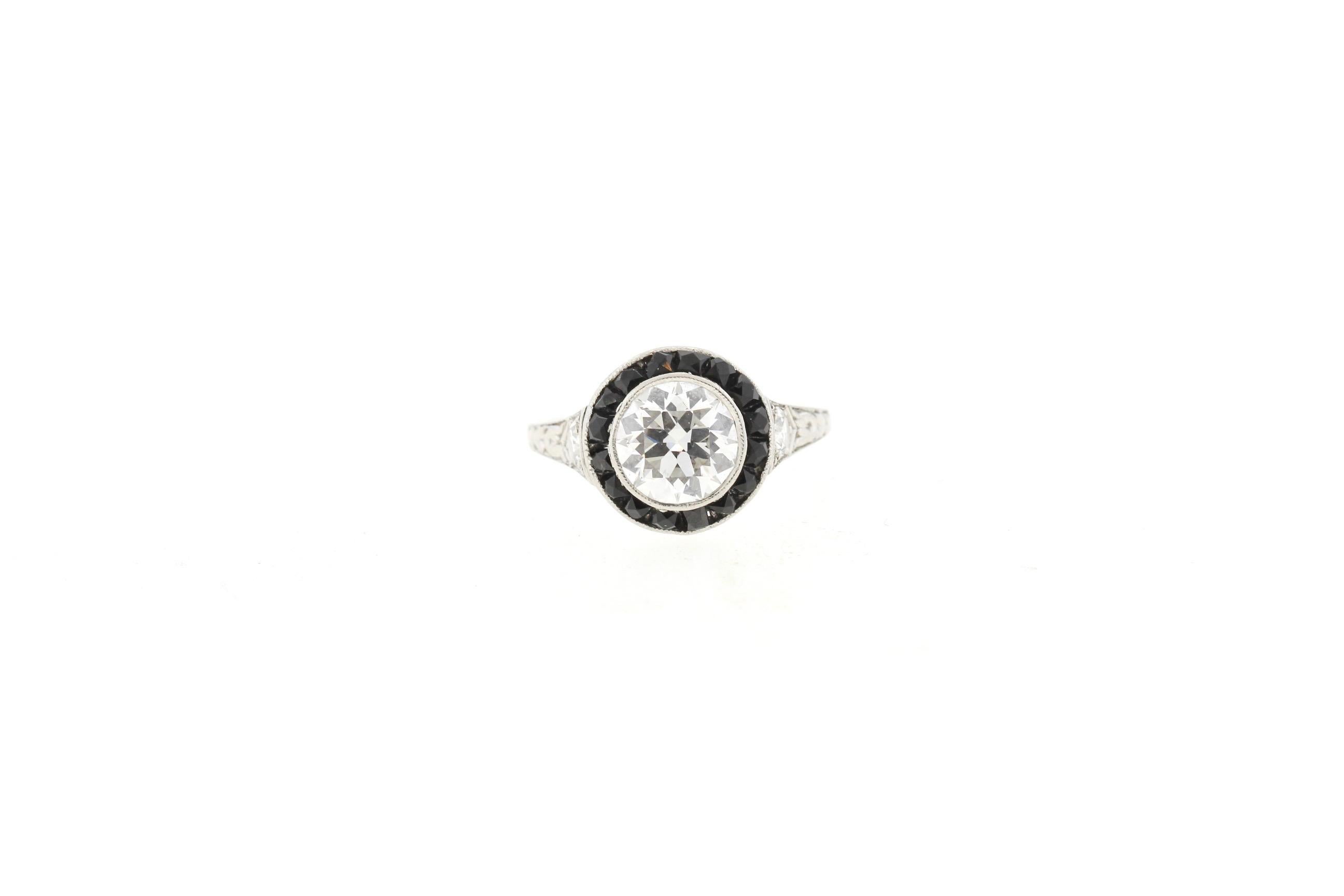 Antique Art Deco Platinum Diamond Onyx Halo Ring In Good Condition In New York, NY
