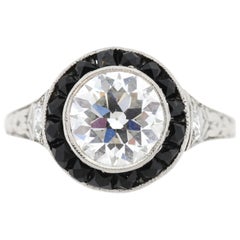Bague Art déco ancienne en platine, diamant, onyx et halo