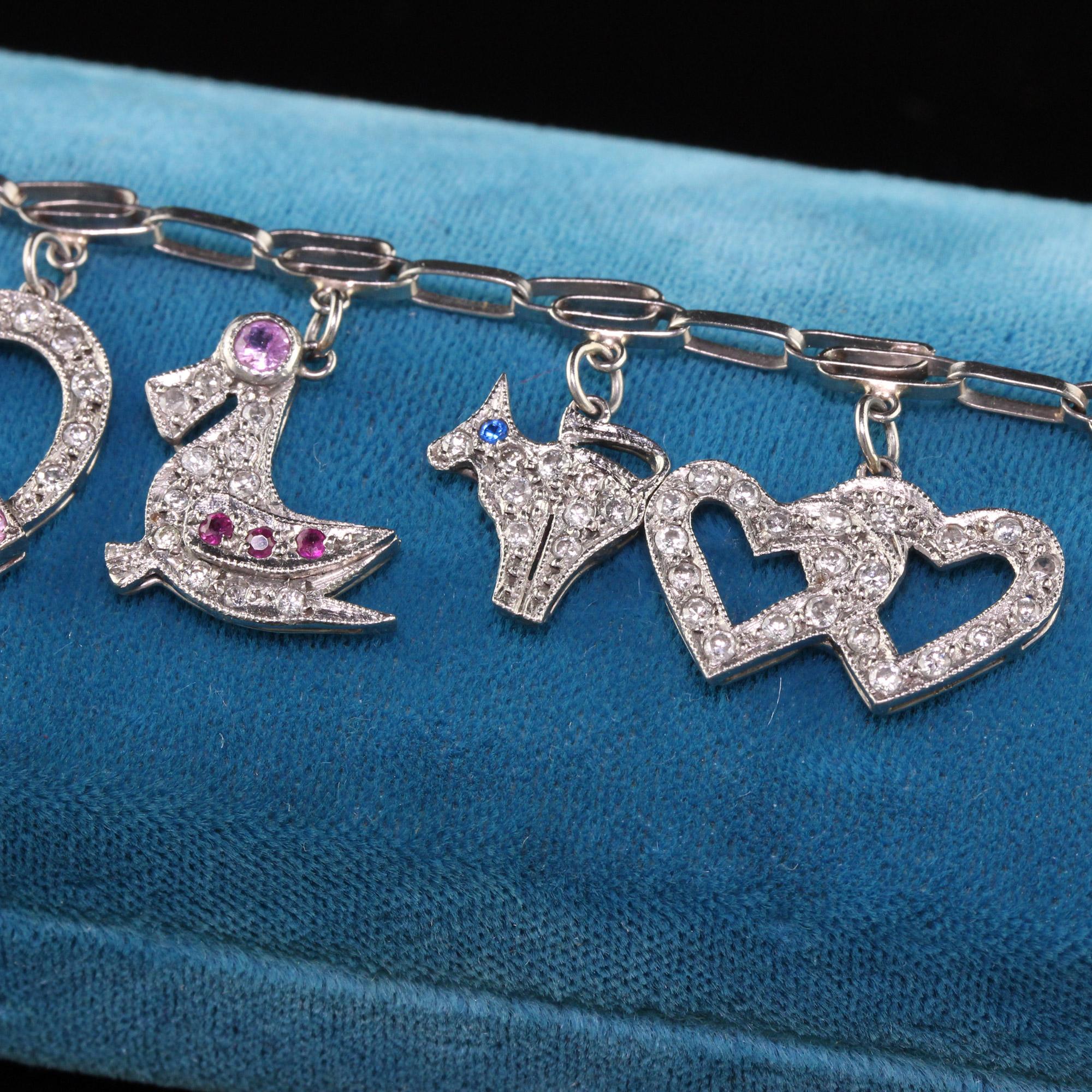 Antique Art Deco Platinum Diamond Ruby Sapphire Charm Bracelet In Good Condition In Great Neck, NY