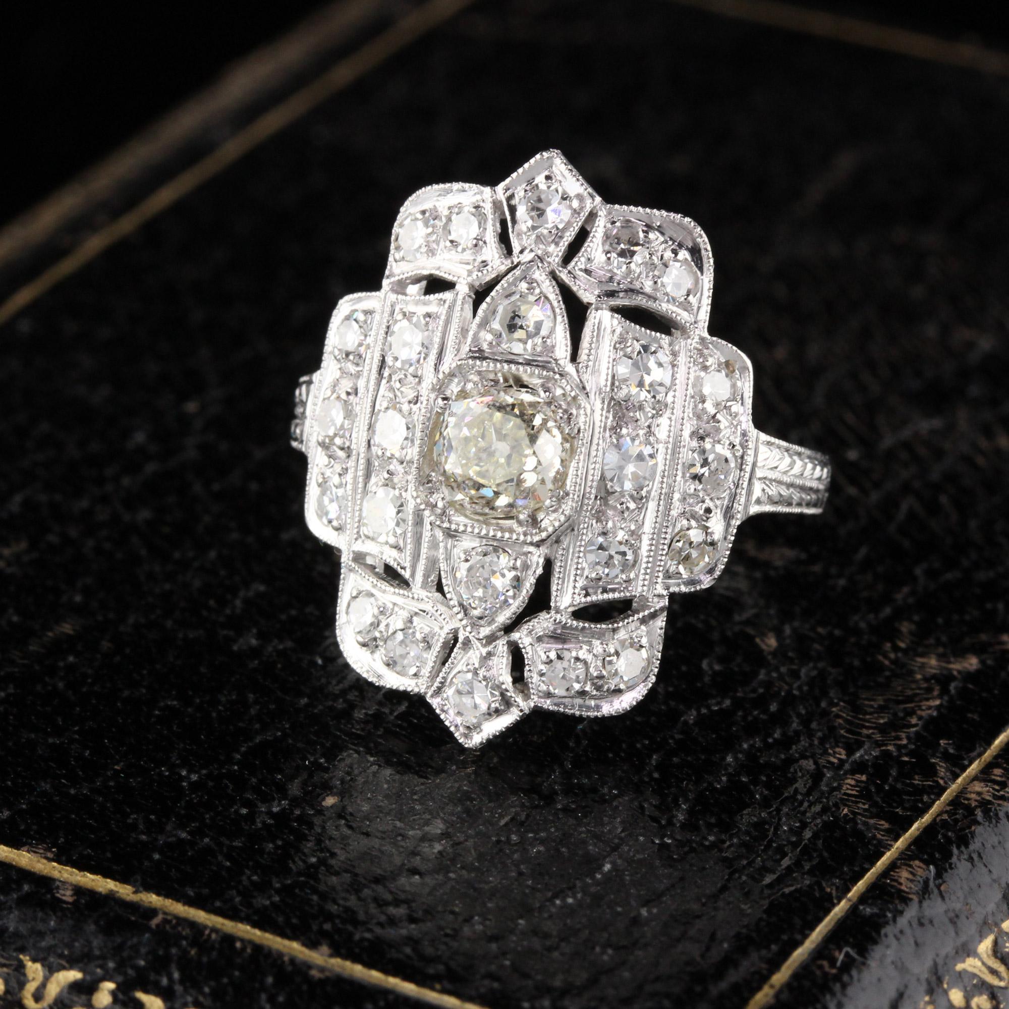 Magnificent Art Deco Shield Ring in Platinum with Old cut diamonds. Excellent condition!

#R0173

Metal: Platinum

Weight: 6 Grams

Center Diamond Weight: 0.72 cts Old Mine Cut

Center Diamond Color: Y-Z (Very Light Yellow)

Center Diamond Clarity: