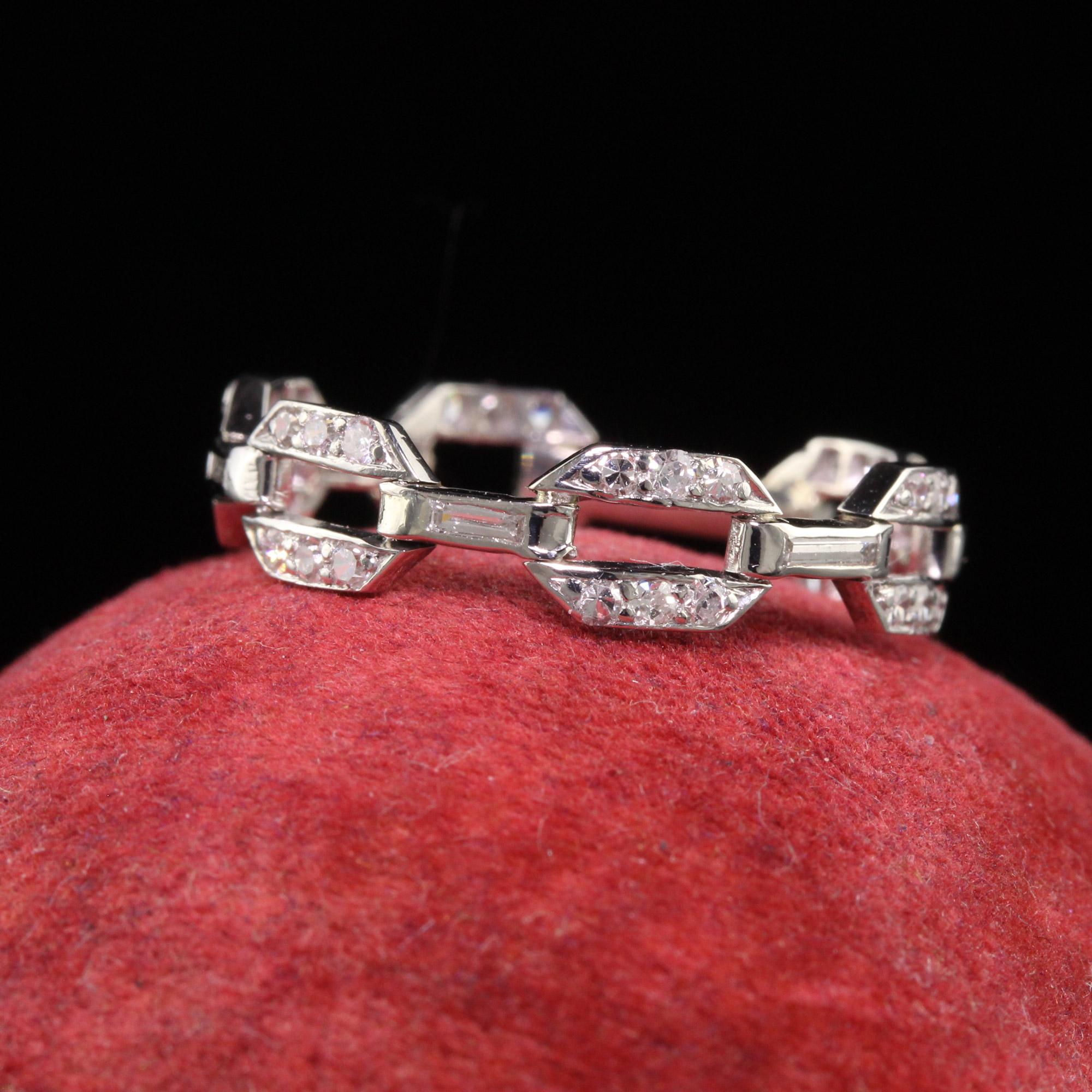 Beautiful Antique Art Deco Platinum Diamond Single Cut Diamond Buckle Link Wedding Band. This gorgeous wedding band is crafted in platinum. The ring has single cut diamonds and baguette diamonds going around the ring. There is a section of the ring