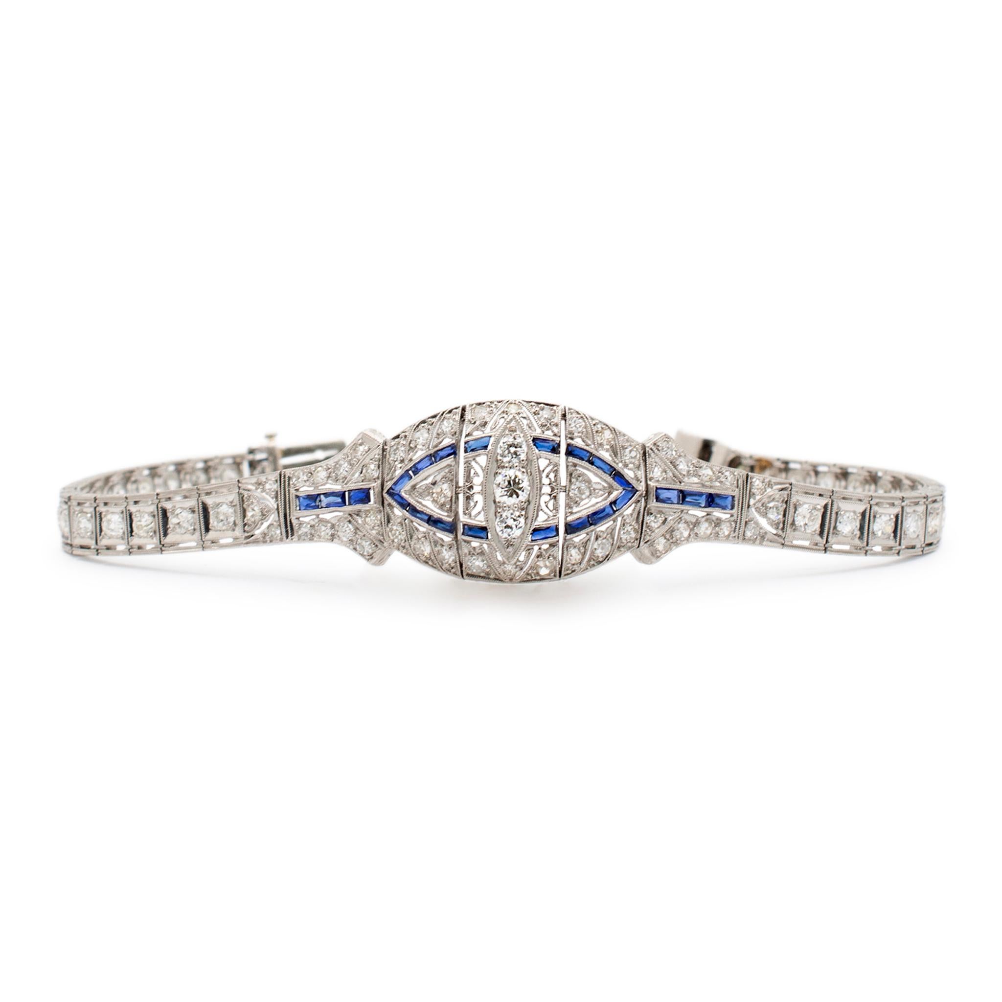 Gender: Ladies

Metal Type: Platinum

Length: 7.00 Inches

Width: 17.70 mm tapering to 4.95 mm

Weight: 19.89 grams

Ladies filigreed 900 platinum diamond and sapphire bracelet. The metal was tested and determined to be 900 platinum.

Pre-owned in