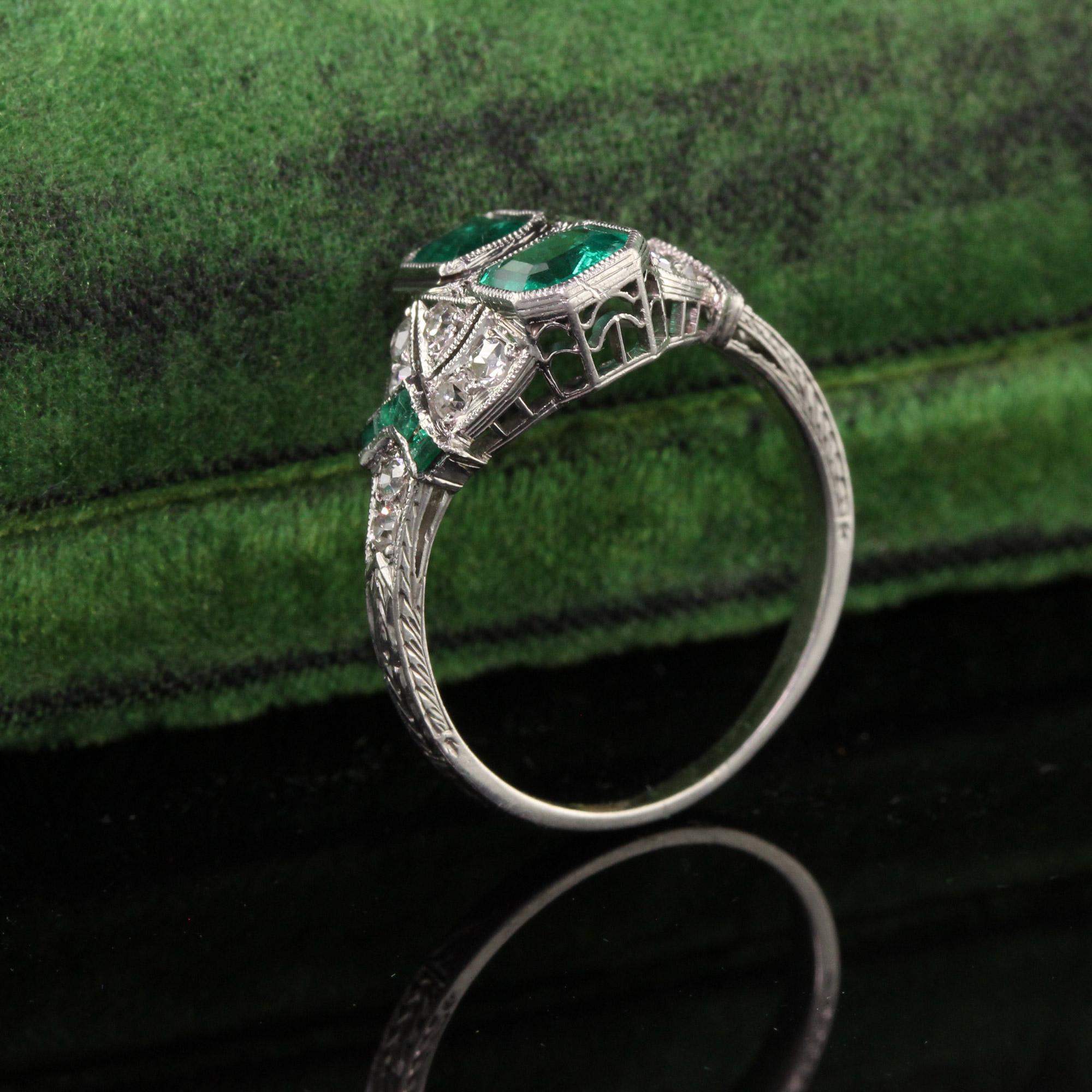 Beautiful Antique Art Deco Platinum Emerald and Diamond Filigree Ring. This amazing ring features two colombian emeralds in the center of a filigree mounting with single cut diamonds and french cut emeralds. This one is a stunner!

Item