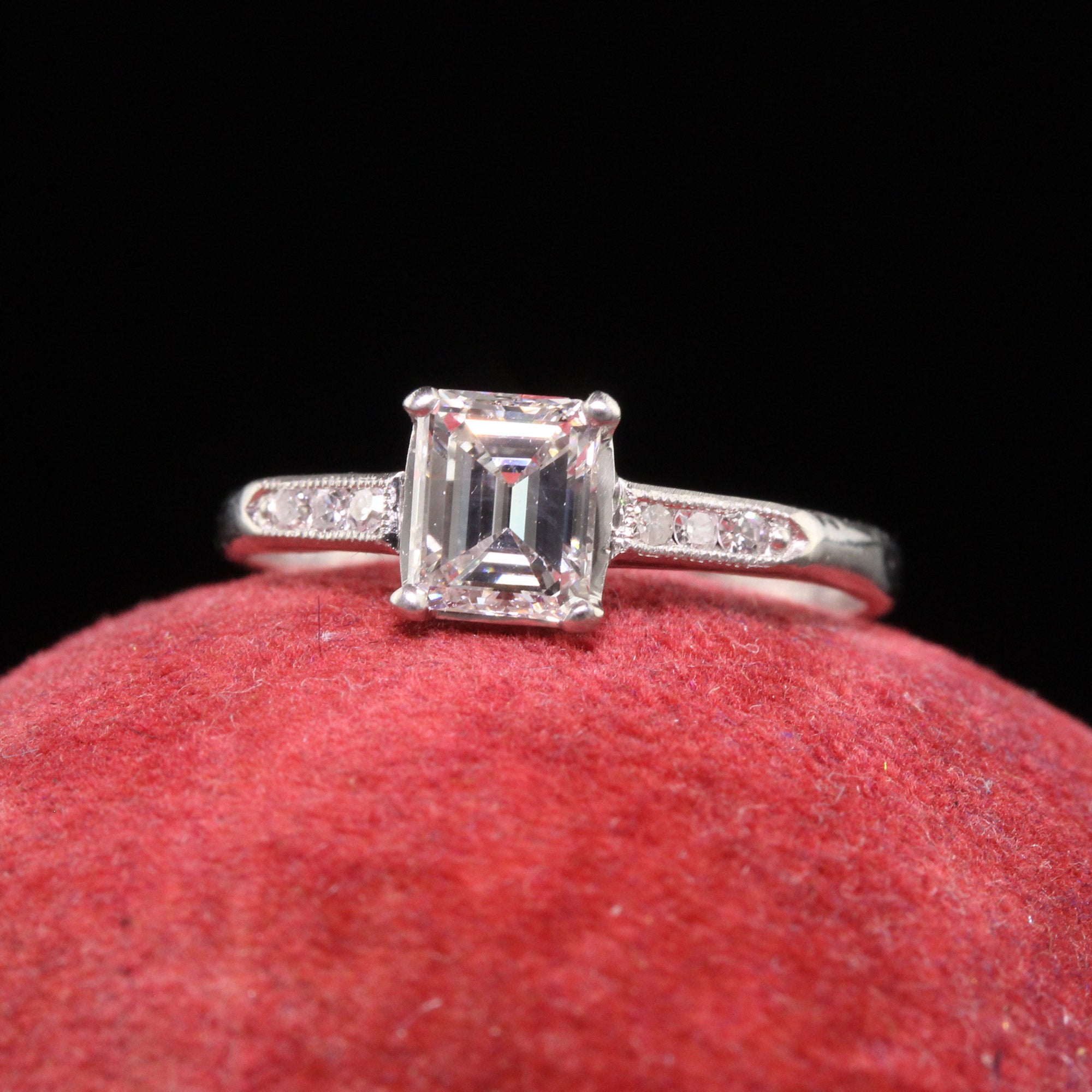 Beautiful Antique Art Deco Platinum Emerald Cut Diamond Classic Engagement Ring. This beautiful engagement is crafted in platinum. The center holds an old emerald cut diamond that has a GIA report. The diamond is set in a classic art deco mounting