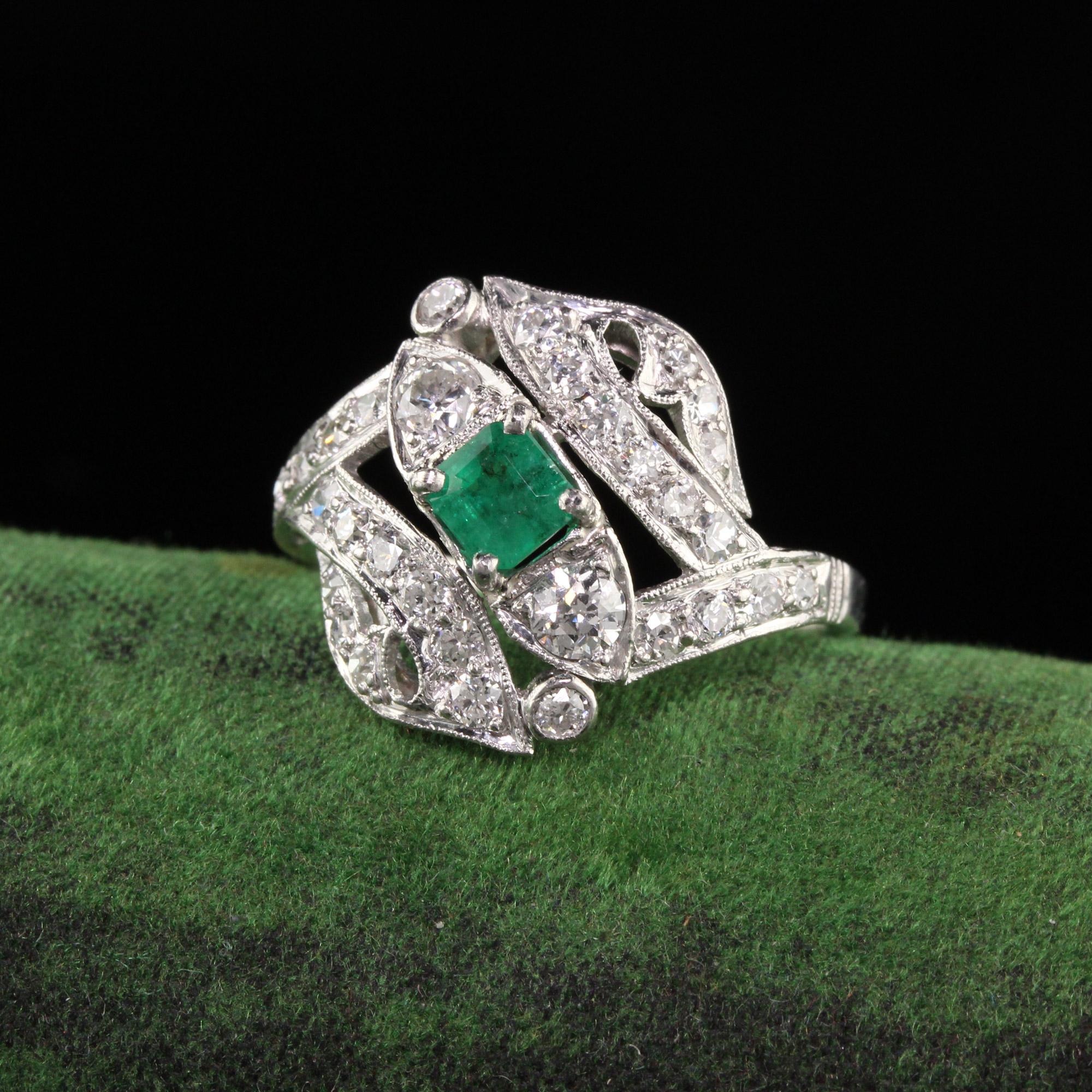 Beautiful Antique Art Deco Platinum Emerald Old European Diamond Statement Ring. This beautiful ring has old european cut diamonds all over the top of the ring with a green emerald in the center.

Item #R1047

Metal: Platinum

Weight: 5.2