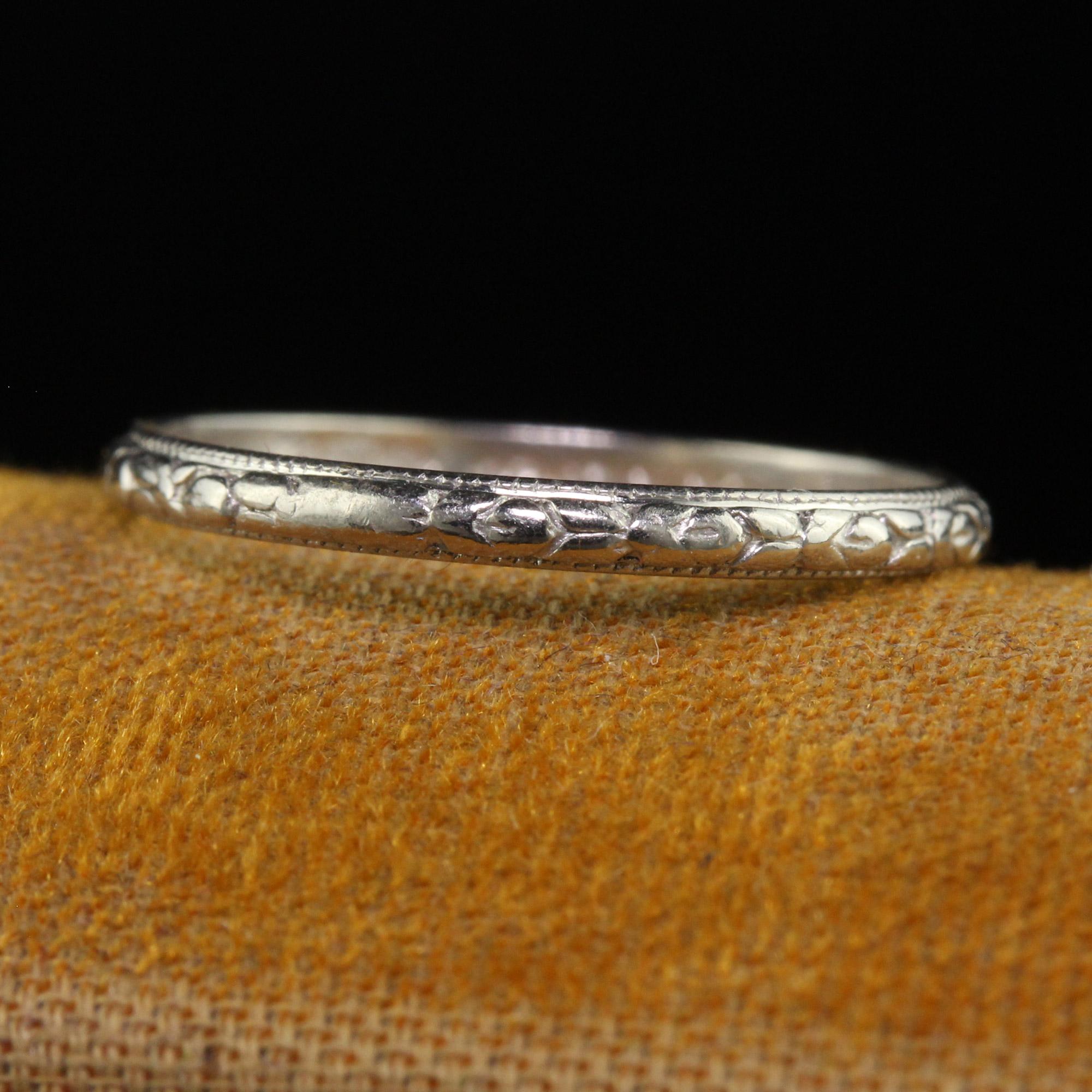Beautiful Antique Art Deco Platinum Engraved Certified Wedding Band - Size 6. This gorgeous antique art deco wedding band is crafted in platinum. The ring has beautiful engravings going around the entire ring. The inside of the shank is engraved